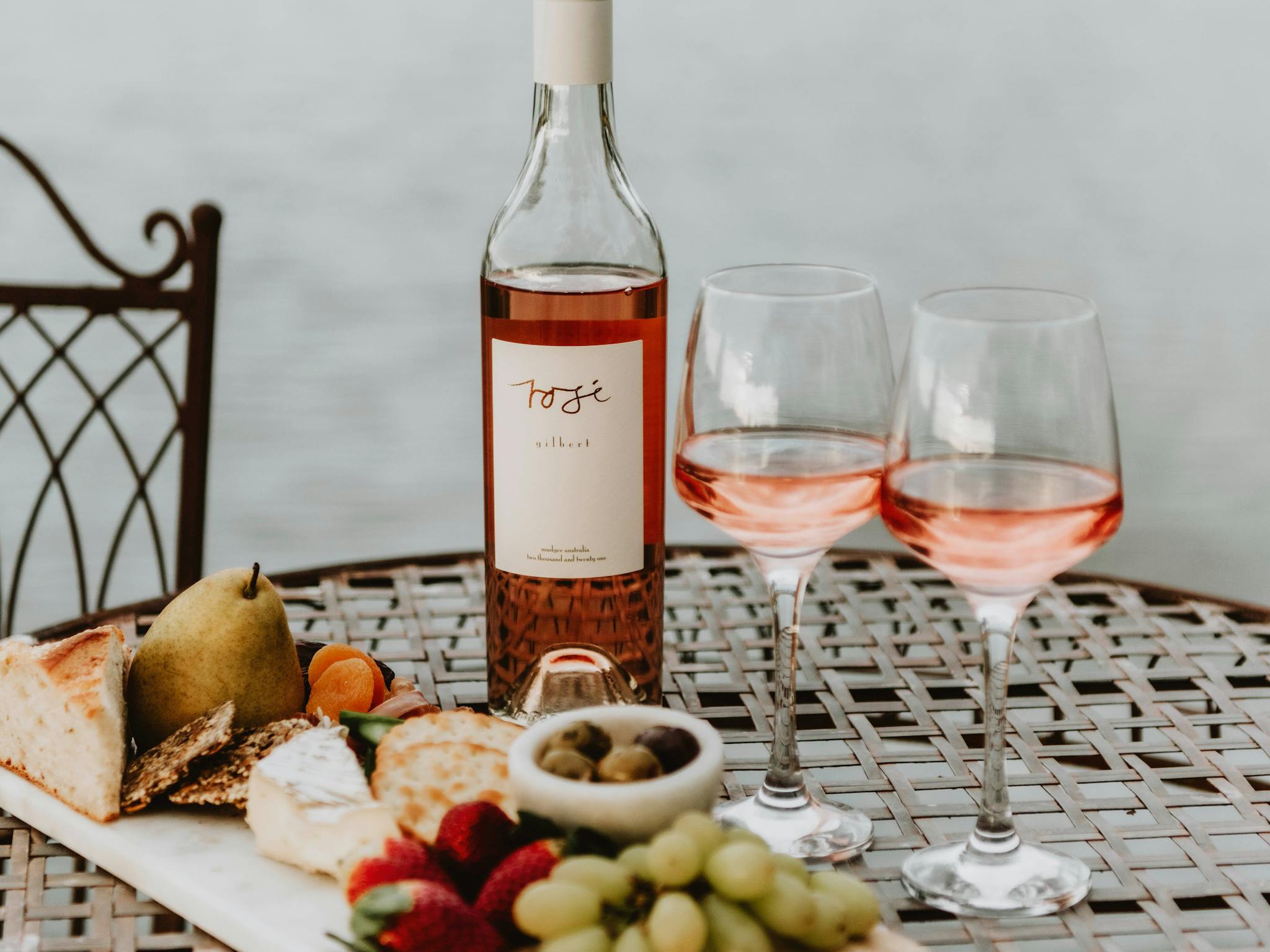Bottle of local wine with two wine glasses on the table