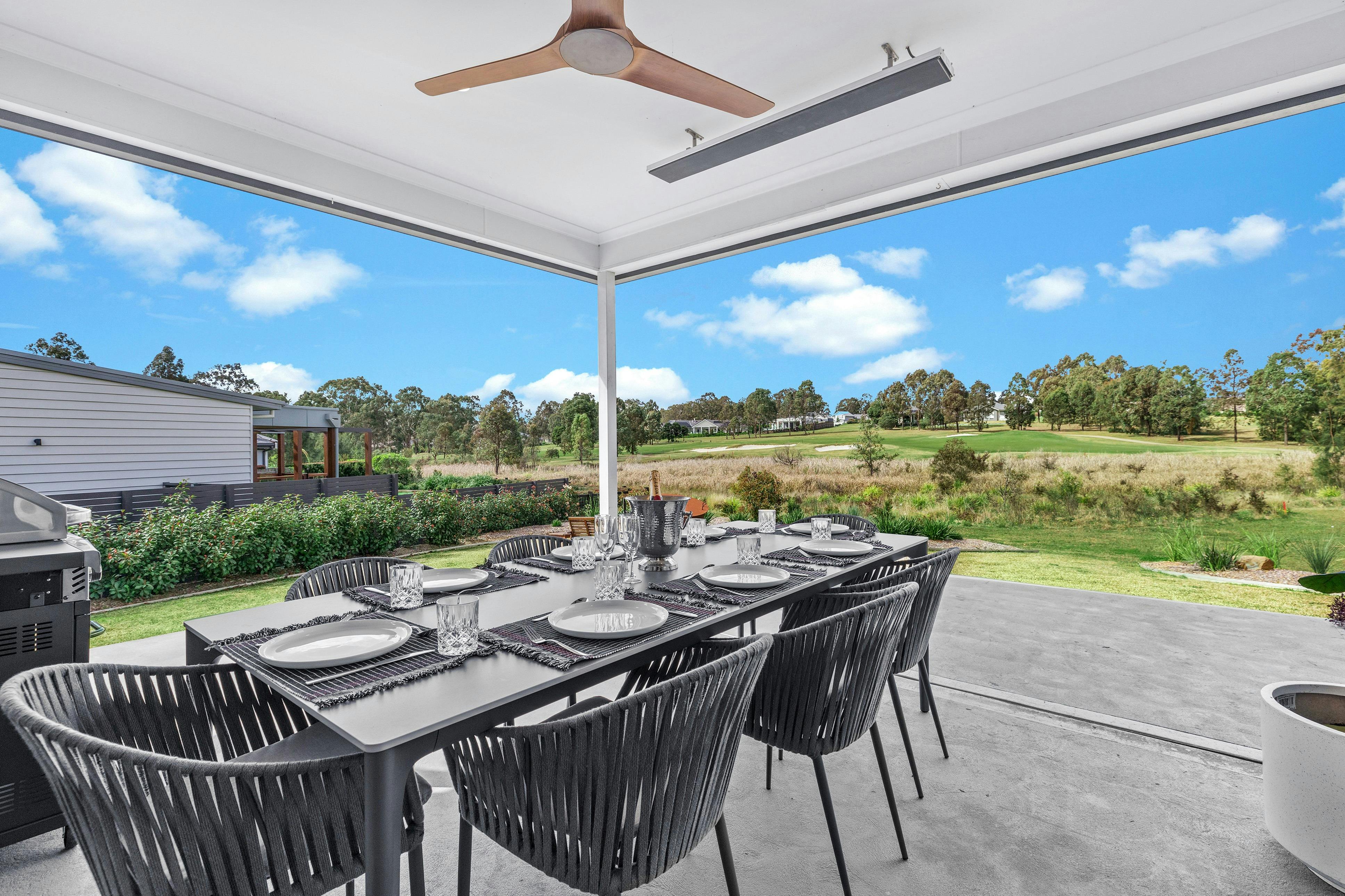 21 Forever outdoor entertainment area including dining table