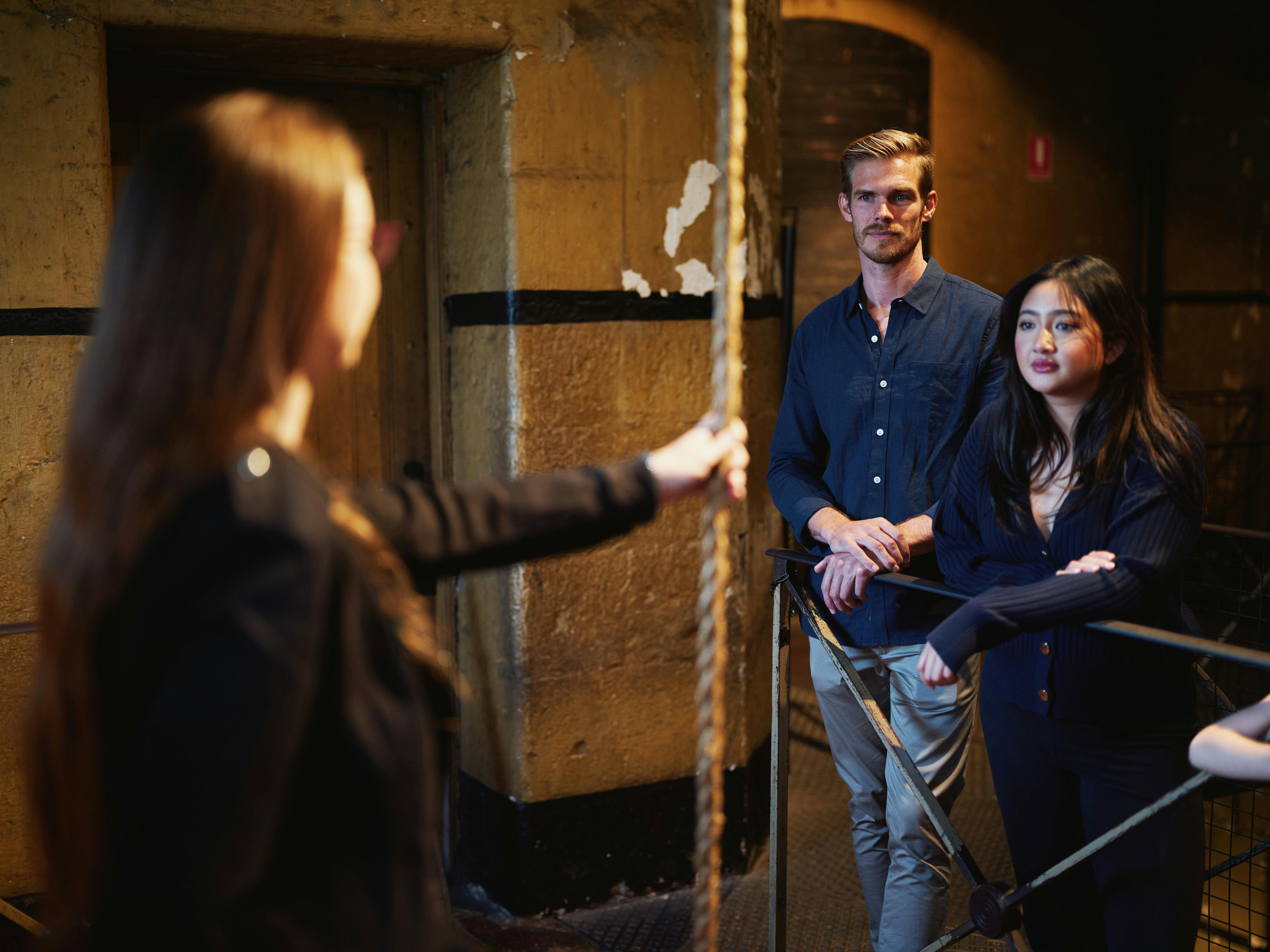 Guide talking to couple on tour