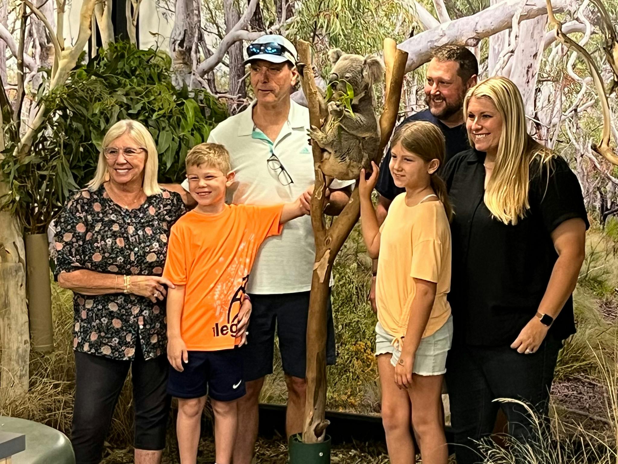 Family with Koala at Featherdale Wildlife Park on a Blue Mountains private tour with Runaway Tours