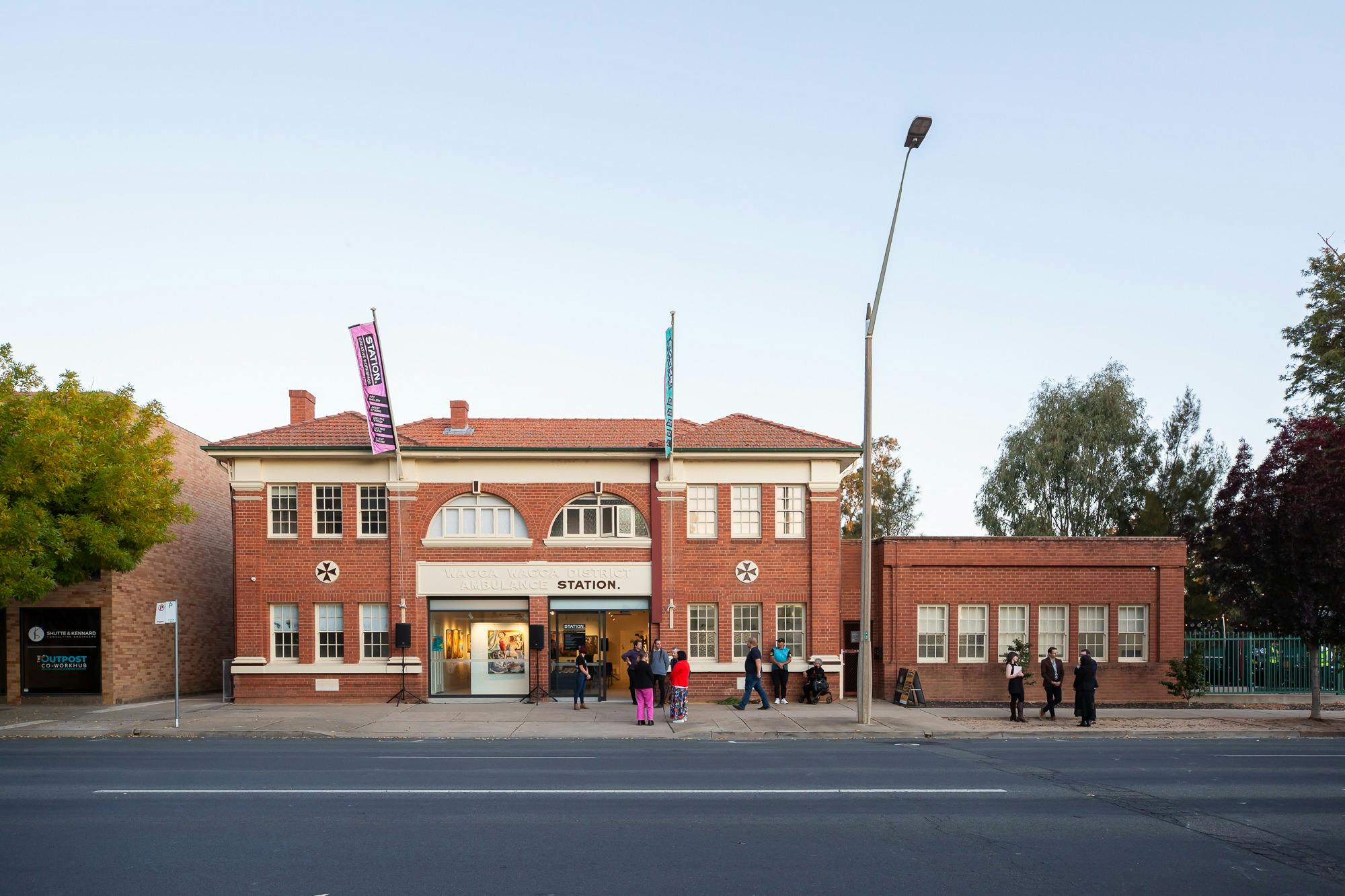 Red brick ambulance station building photographed from street view, now operating as an art gallery.