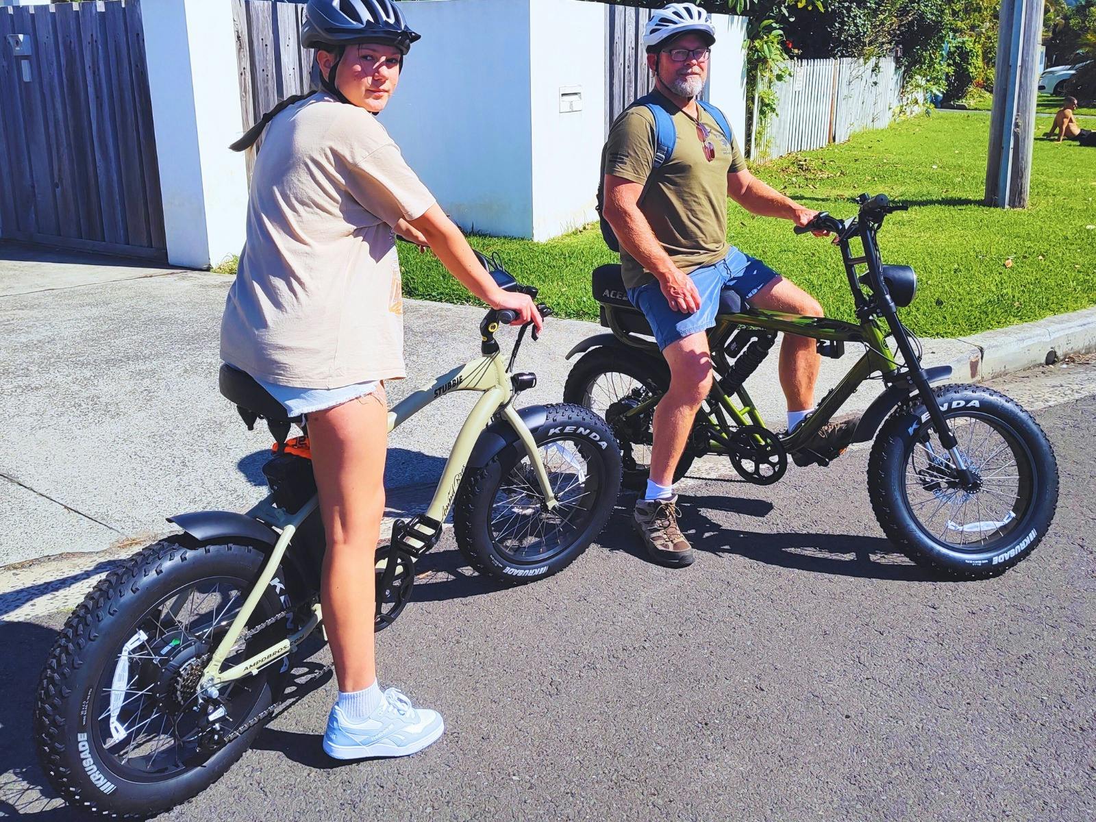 Father and daughter, school holidays, ready to explore the stunning coastal cycleway
