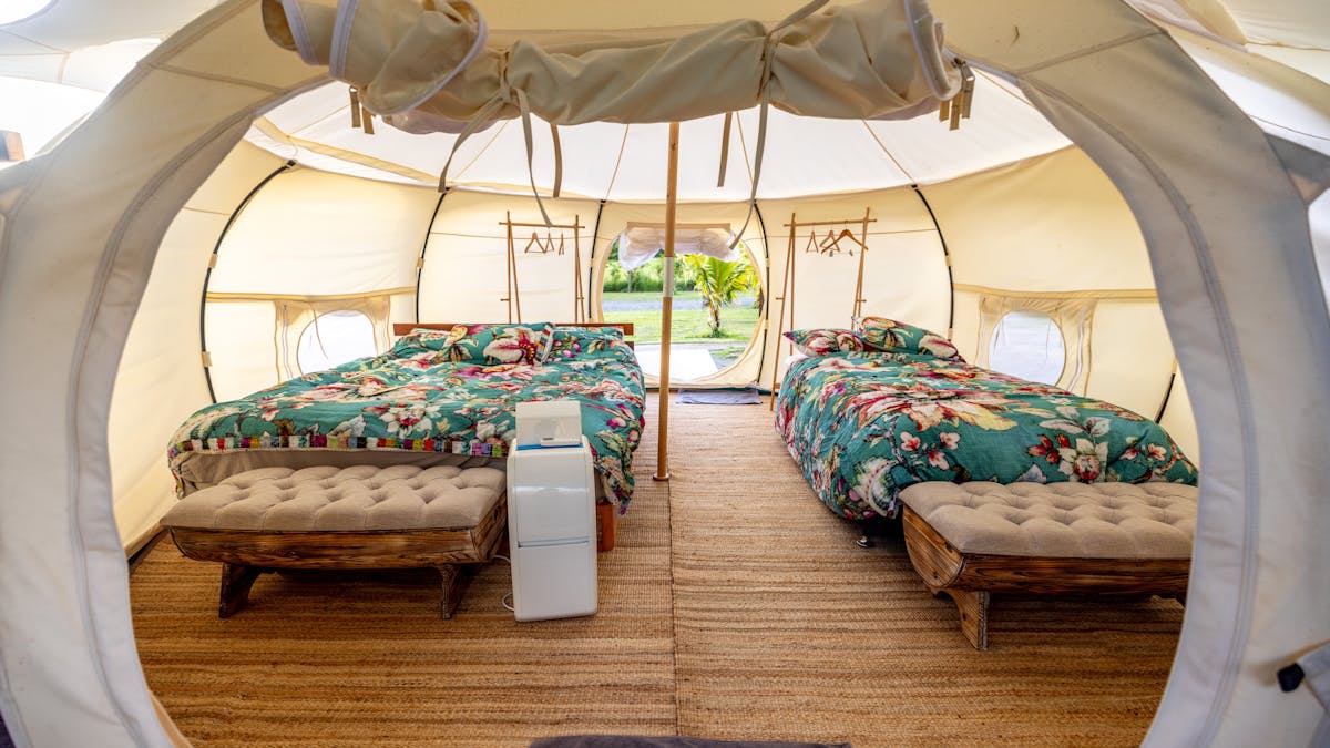 "Our luxury Glamping Tents offer premium comfort with thoughtful climate control, featuring both ind