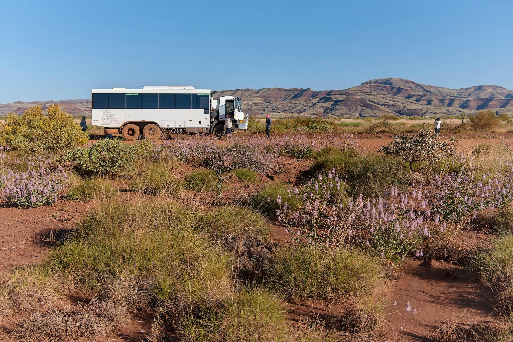 6WD tour coach driving along a dirt road