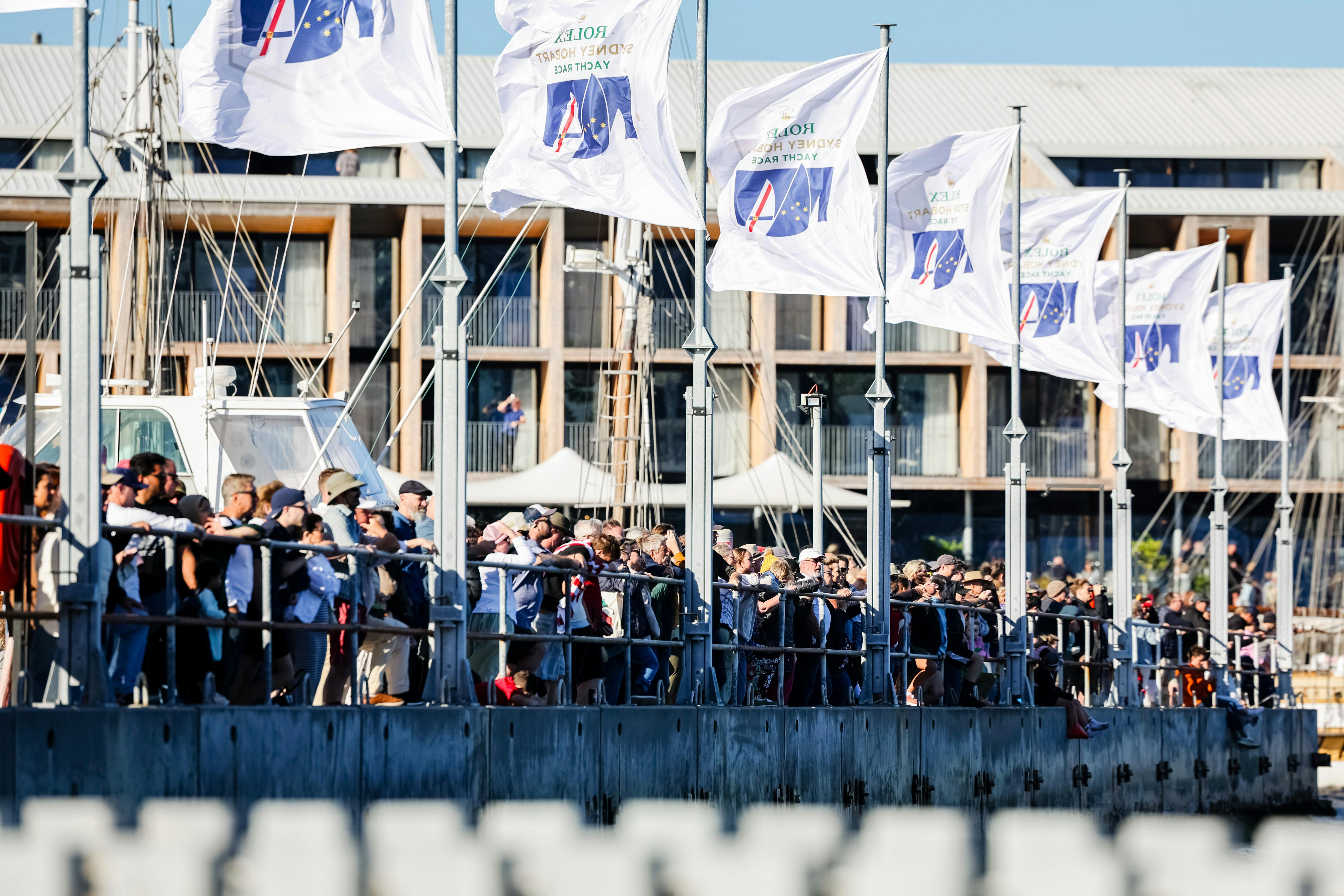 Spectators await the fleet at the Hobart Race Village