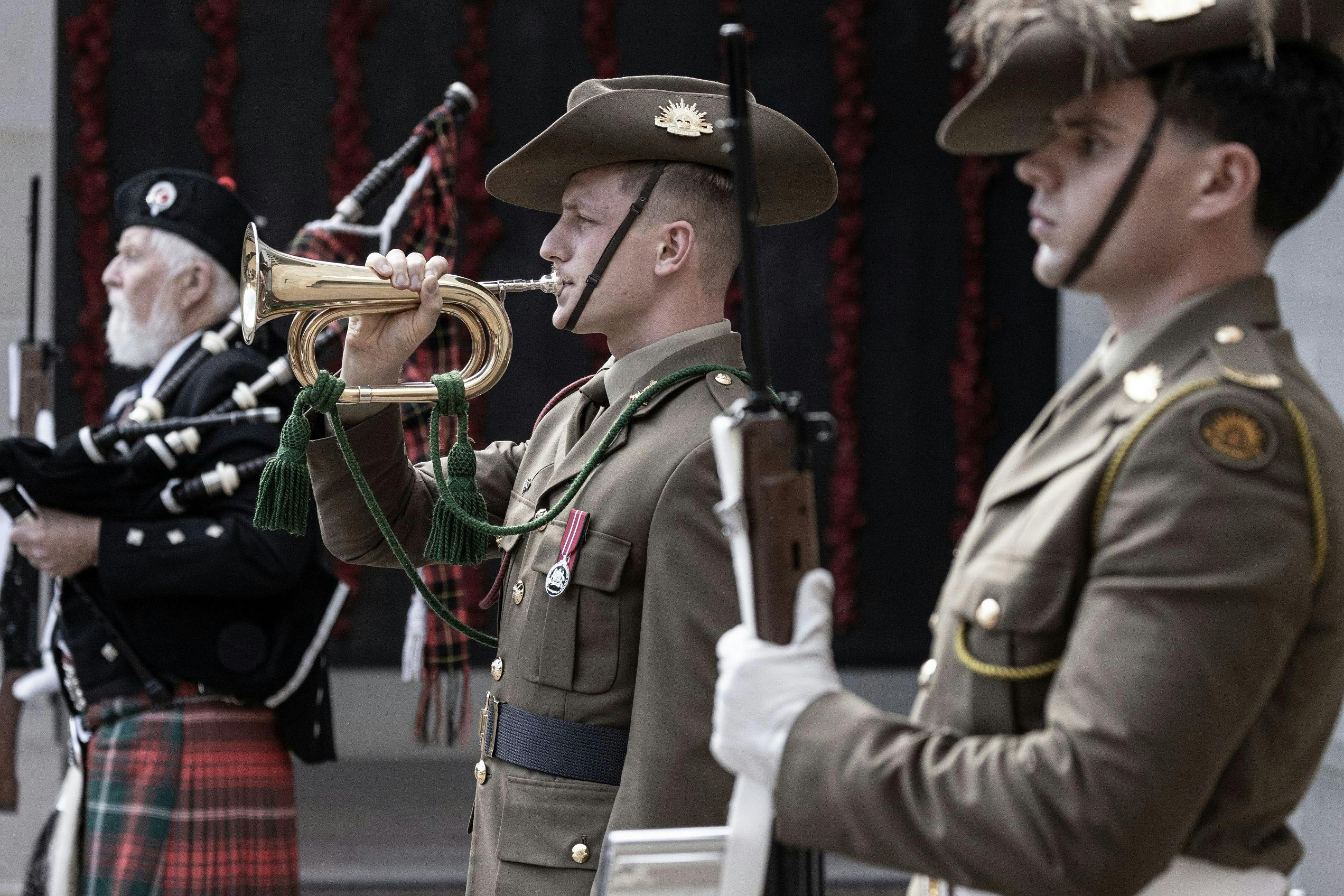Bagpiper and bugler during sounding of the last post