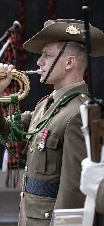 Bagpiper and bugler during sounding of the last post