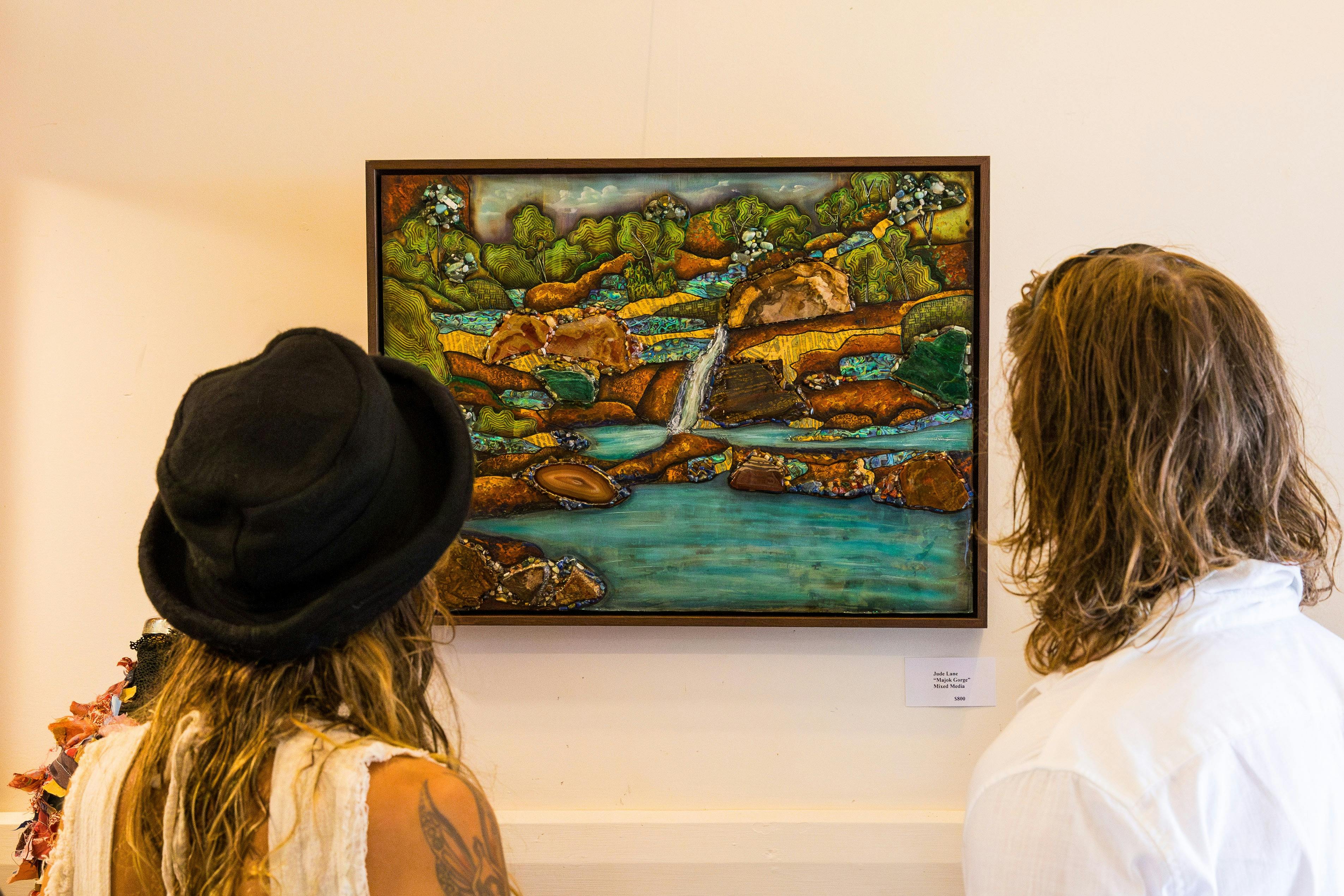 Couple admiring the artwork on display