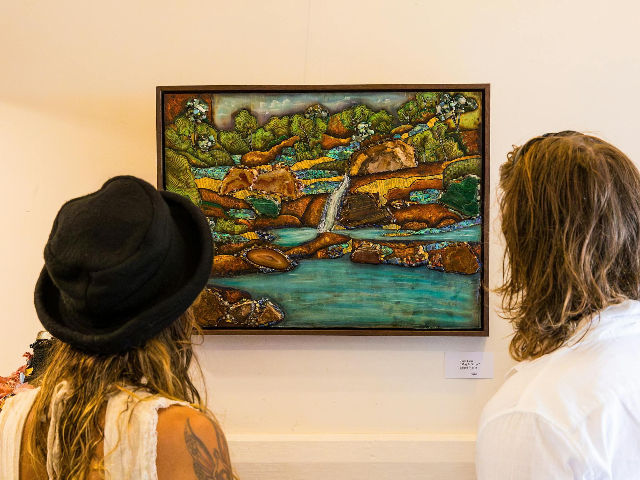 Couple admiring the artwork on display