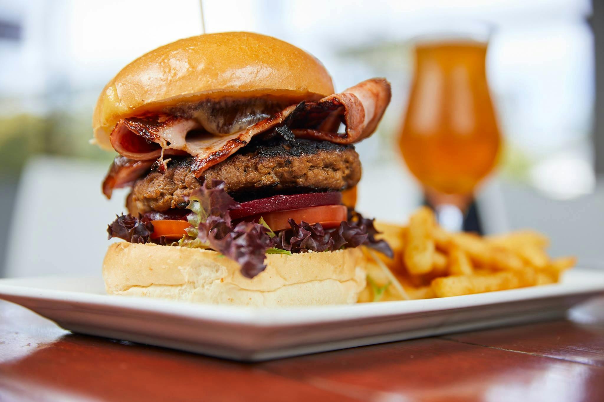 Juicy burger and fries on a plate