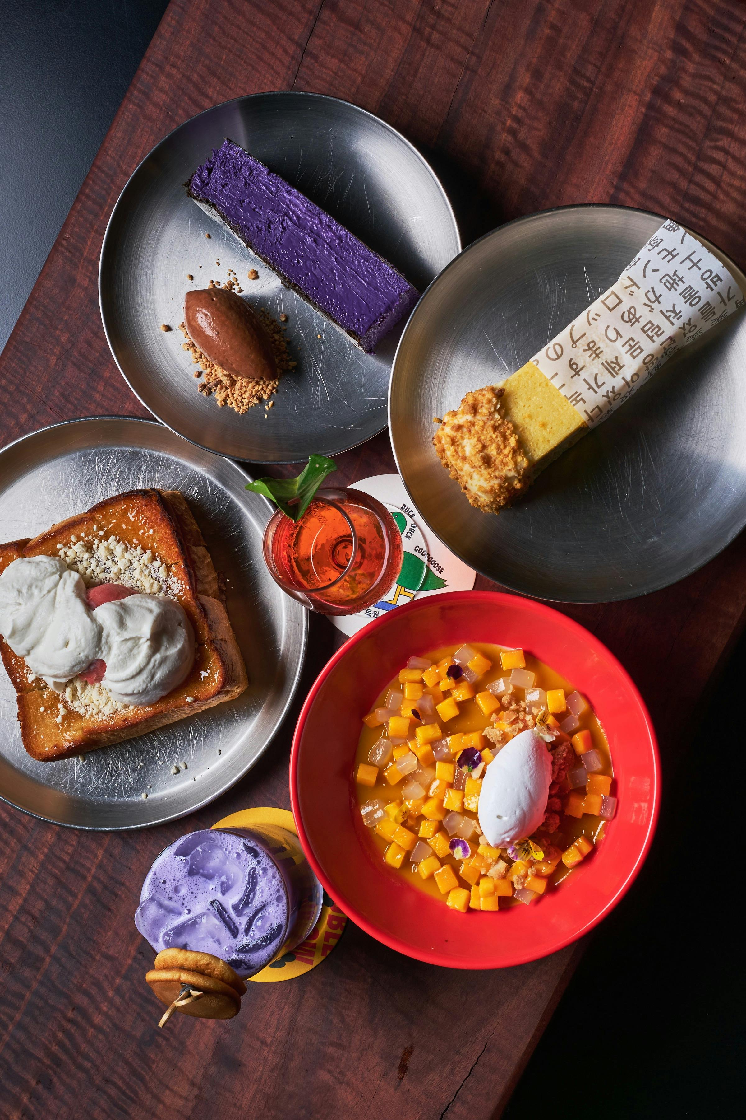 A flat lay photo of our current dessert menu, featuring cereal milk ice cream sandwich and more.