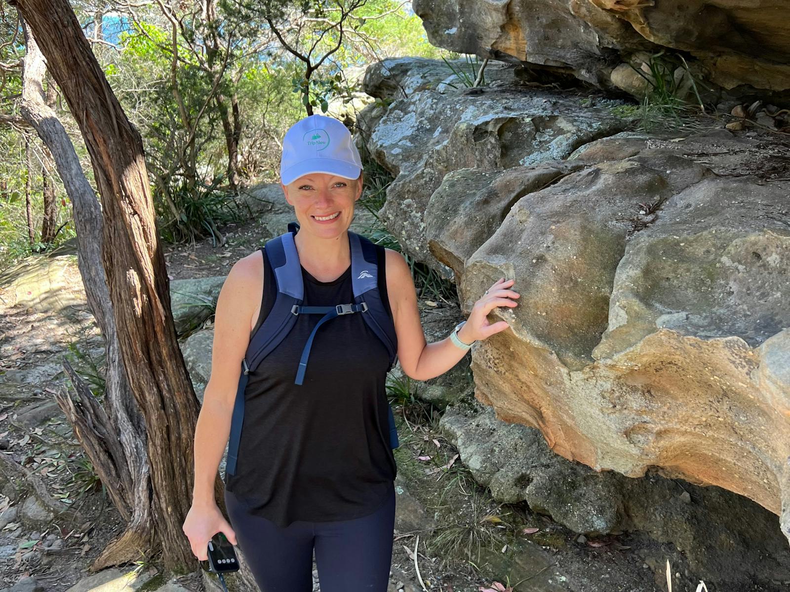 Guide next to a rock.