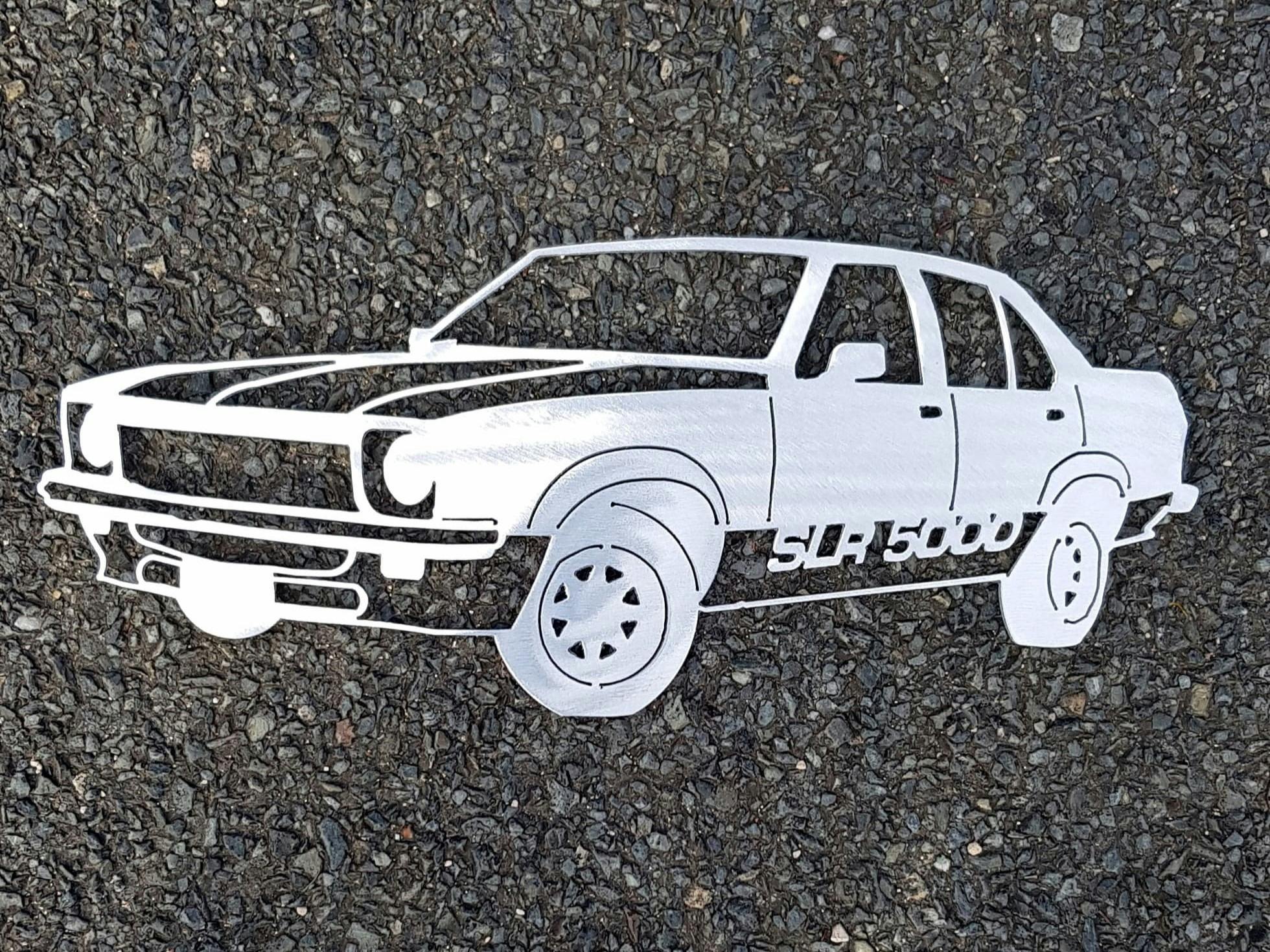 A Brushed Aluminium SLR 5000 car on a bitumen background