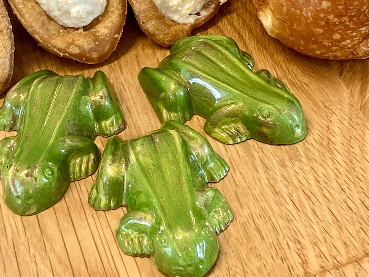 handcrafted chocolate frogs filled with Gianduja or local macadamia praline