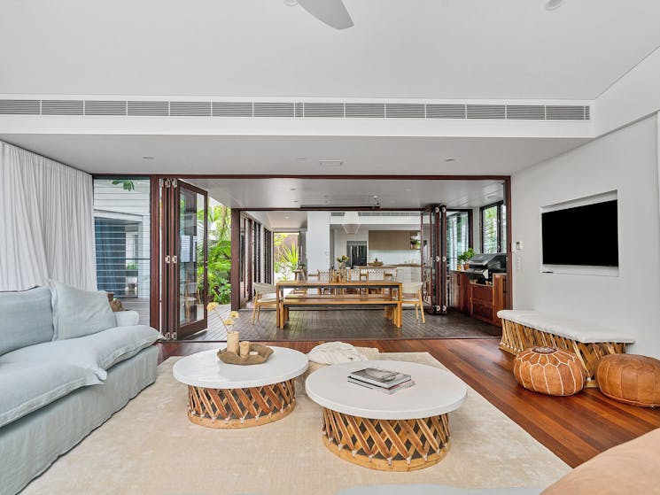 Tidemark - Byron Bay - Living Room flow to Outdoor Dining, Indoor Dining, and Kitchen