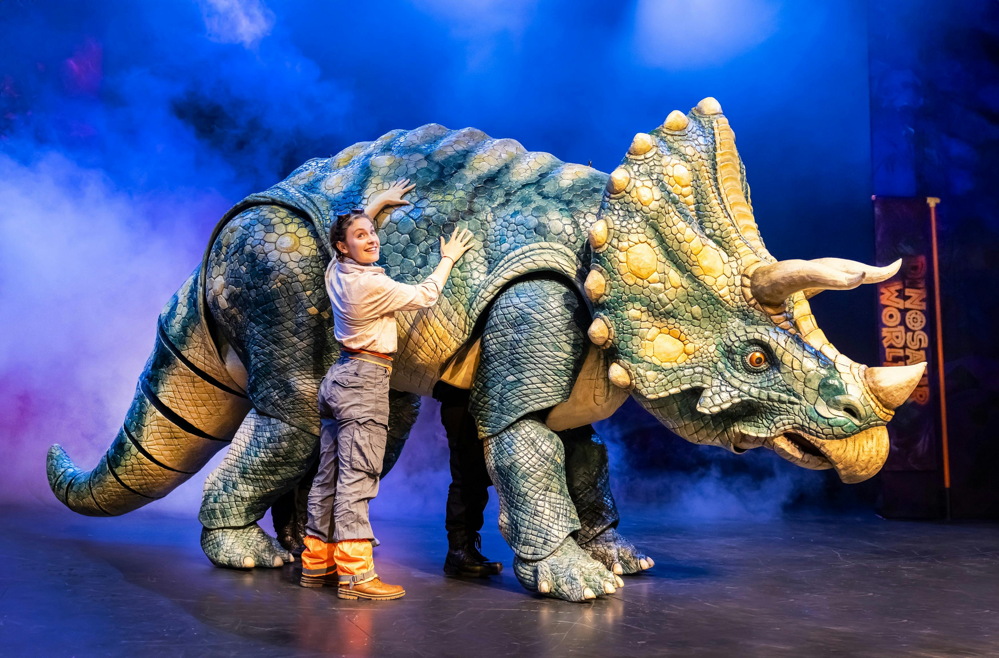 Performer with Dinosaur Puppet