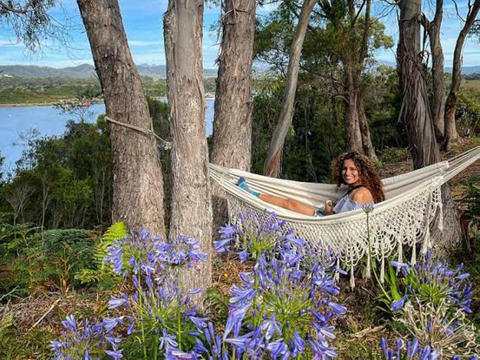 Find a place to relax surrounded by nature, like a hammock in the trees overlooking the harbour.