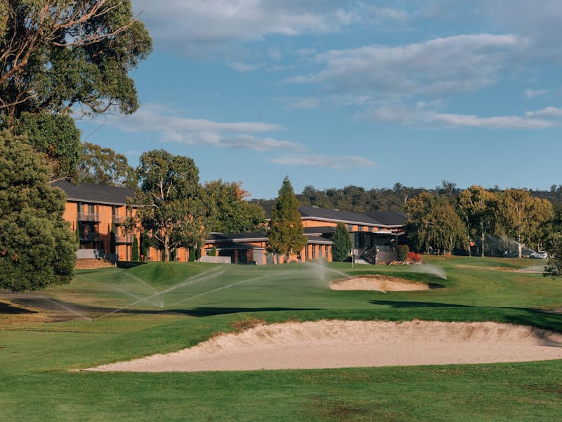 Golf course with Country Club Resort in background