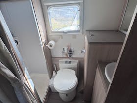 caravan ensuite with shower, toilet, vanity and washing maching