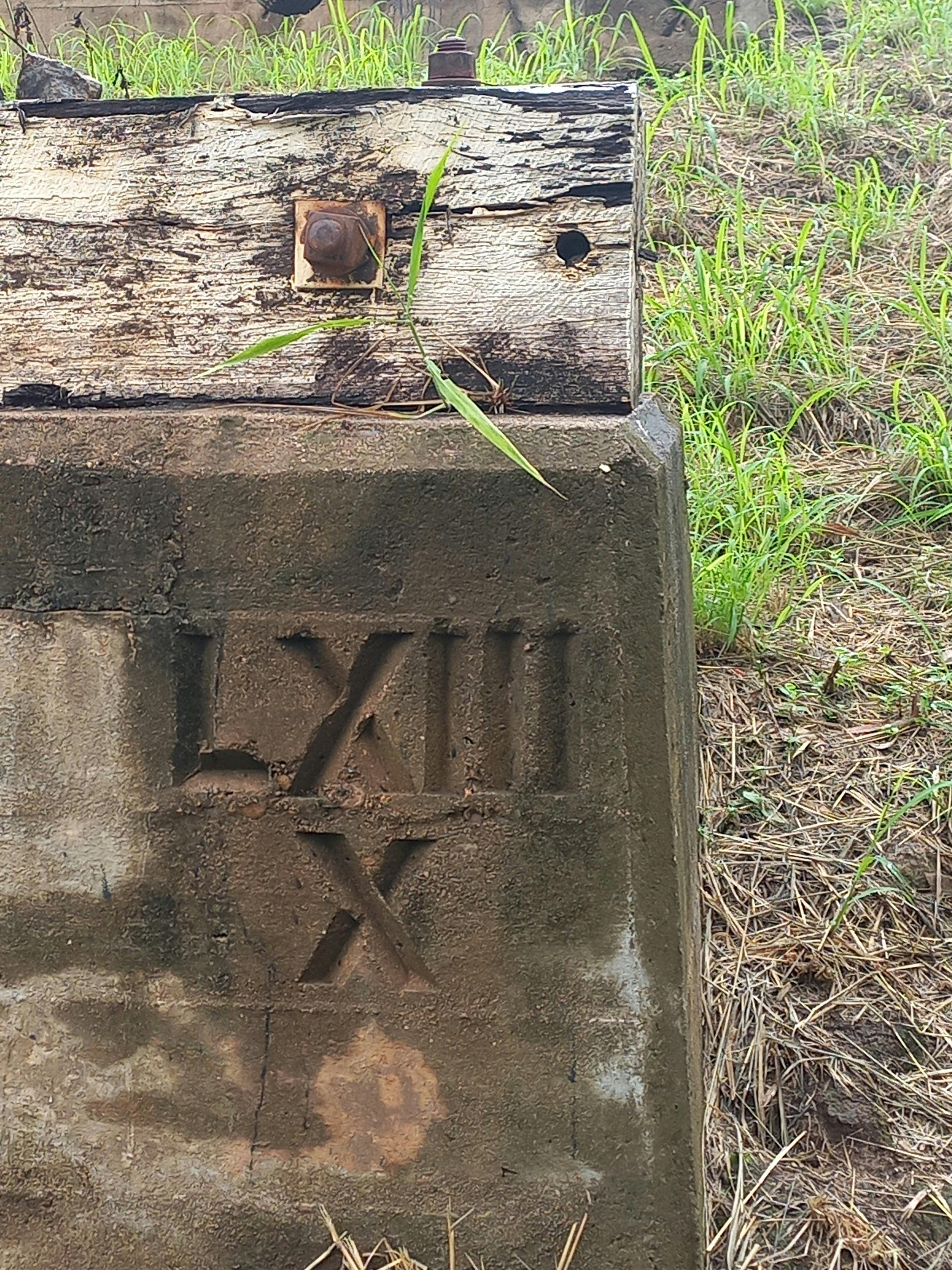 Historic etchings on the concrete bridge pylons.