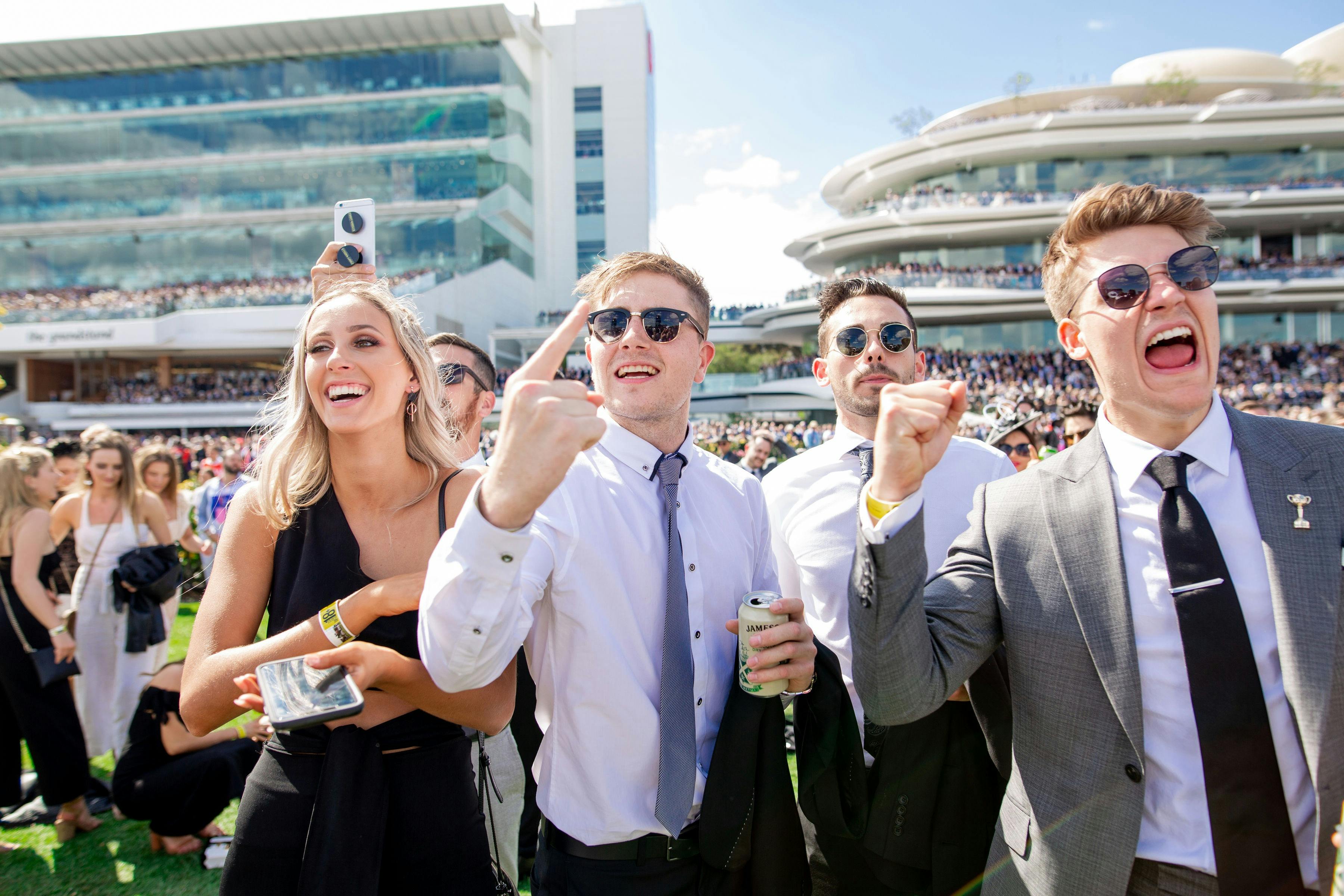 Racegoers enjoying the atmosphere on the Flemington Front Lawn at the 2018 Melbourne Cup Carnival
