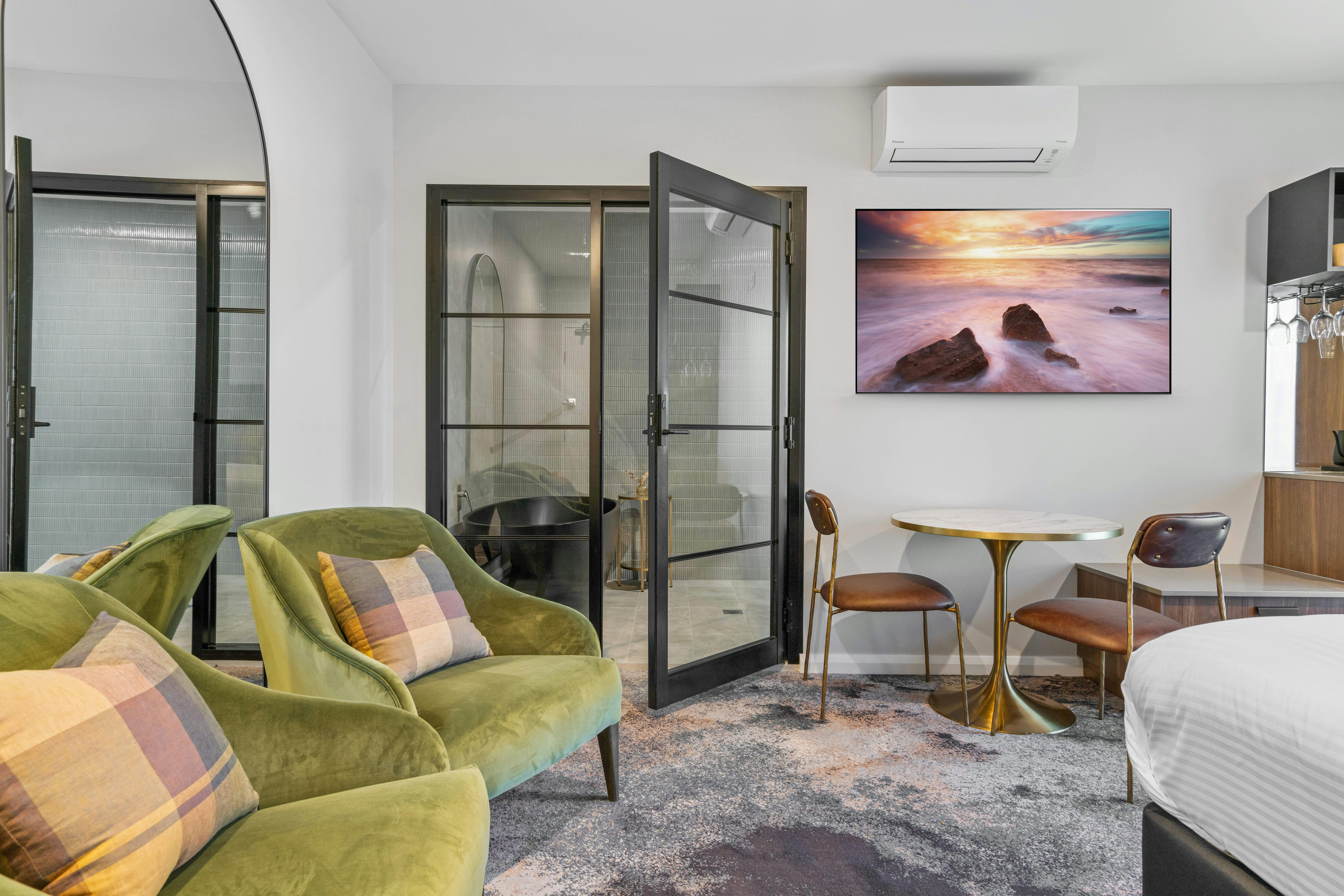 Modern elegant design with a freestanding bathtub & a double walk-in rain shower.