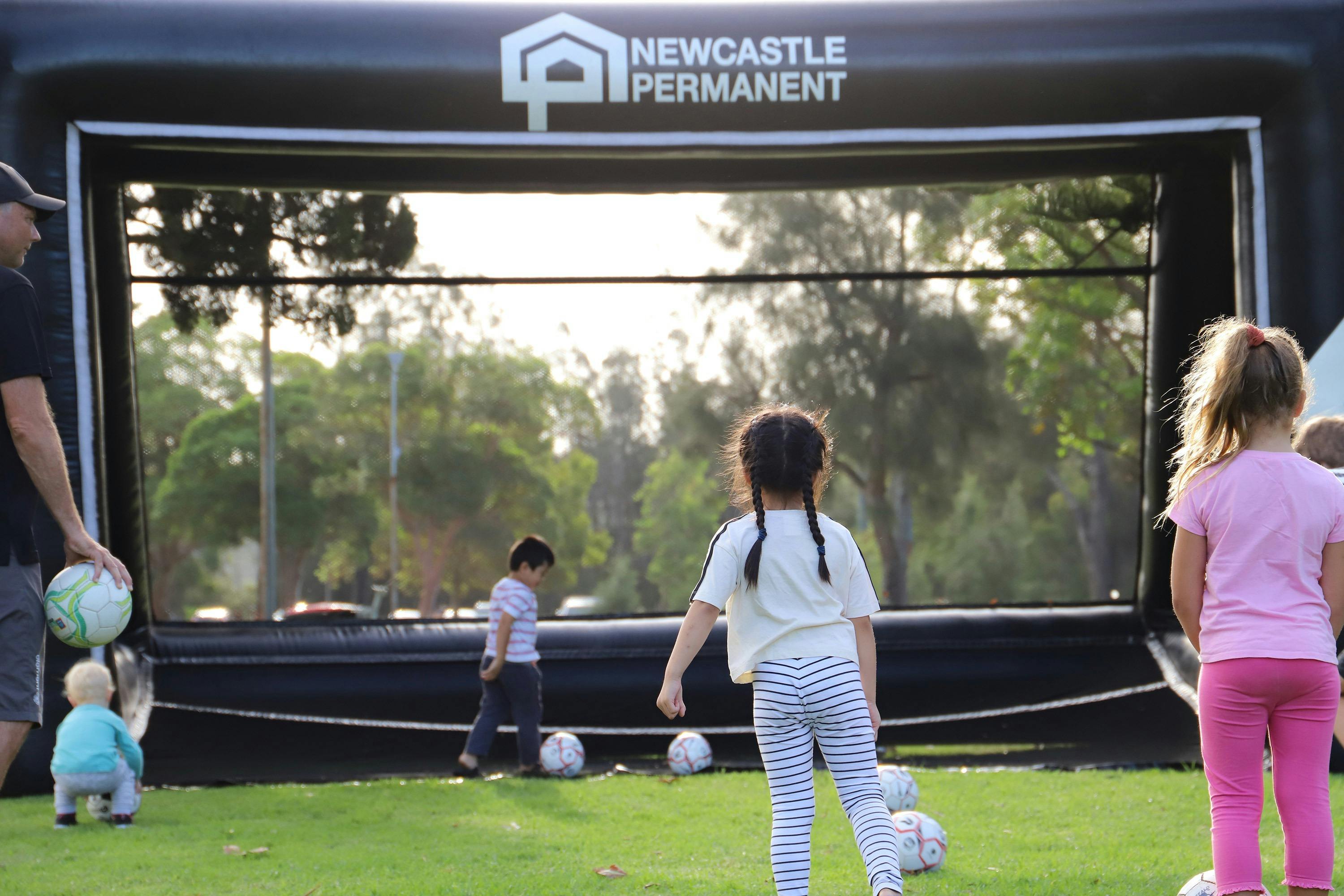 Young children playing soccer