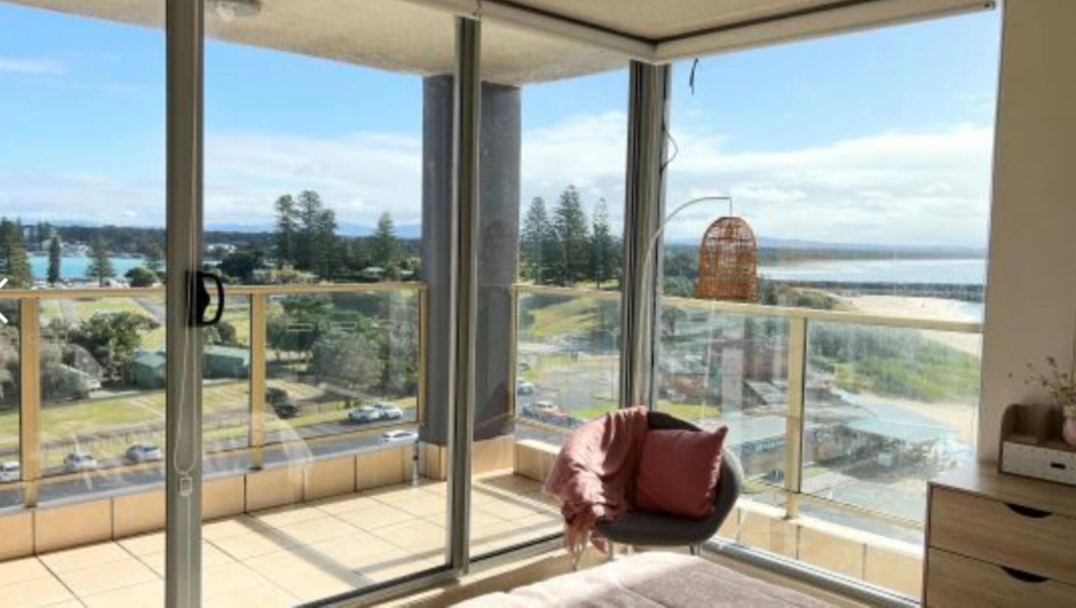 Lounge room out to balcony and beach views
