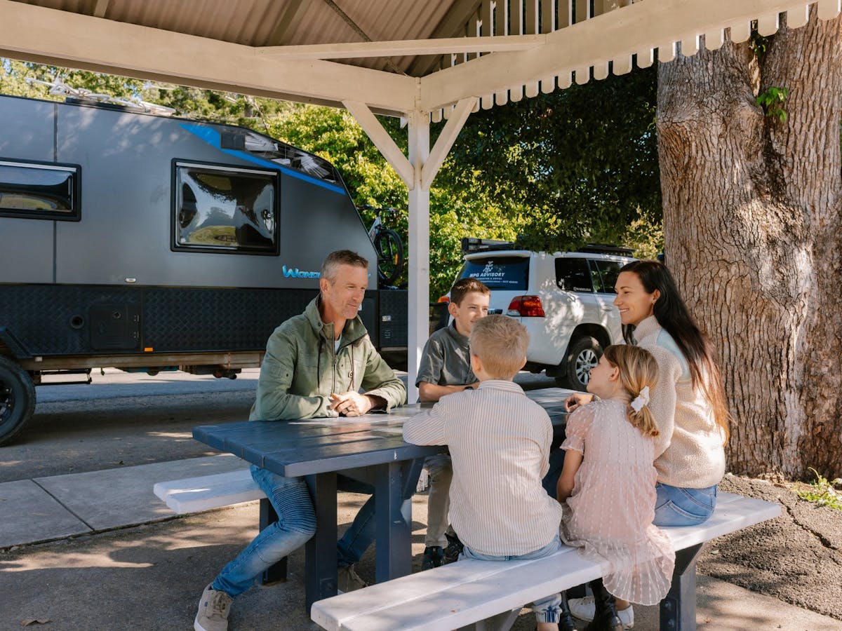 Family sitting at a picnic table
