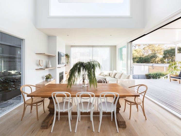 The light filled dining area with timber table