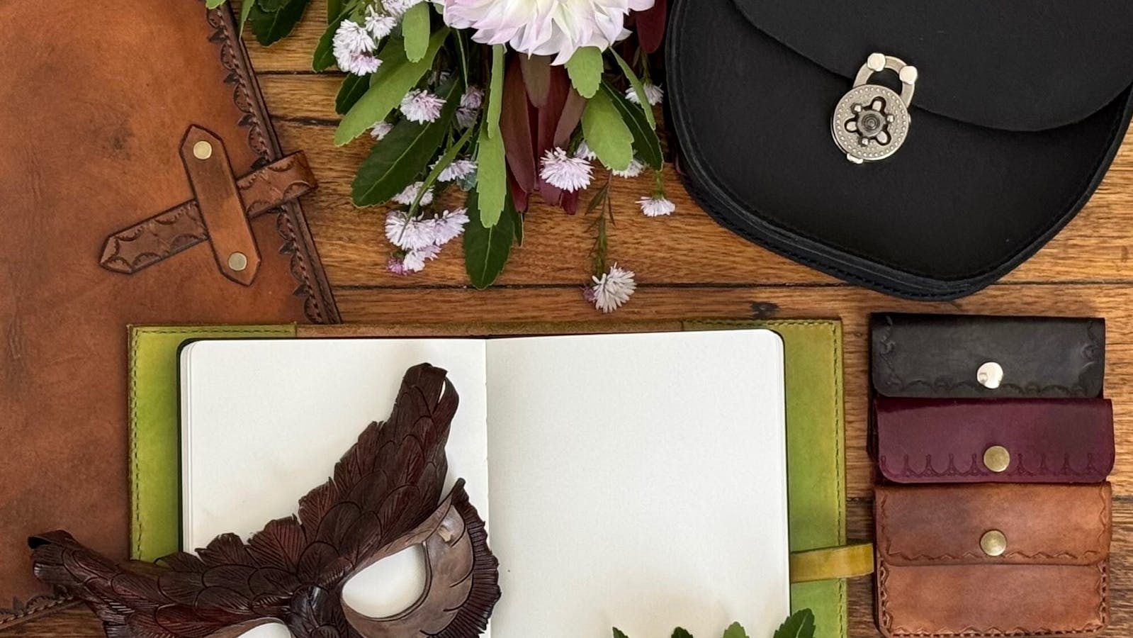 Handmade leather goods including custom made masks, belts, journals and bags