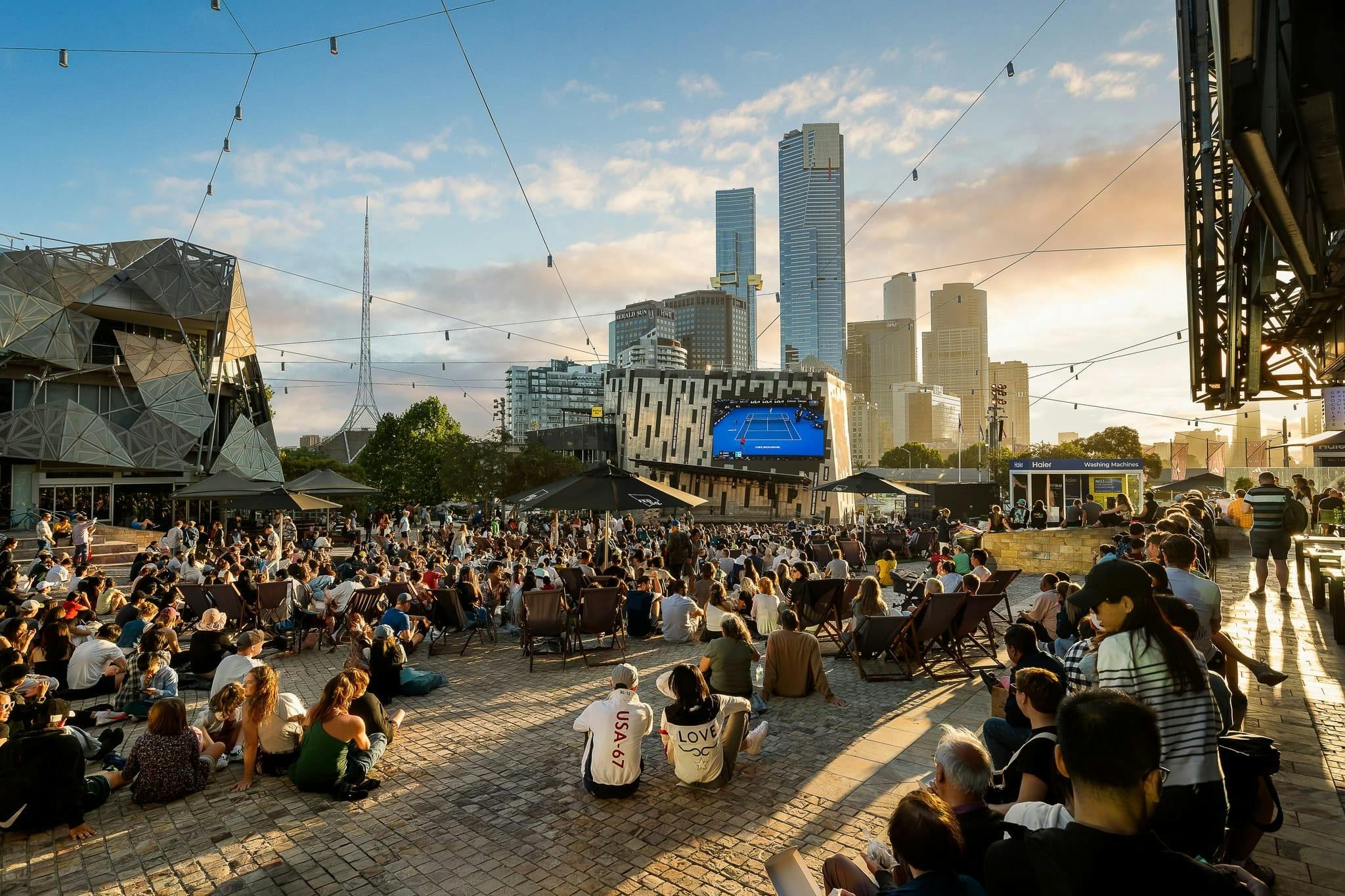 A crowd gather to watch the Australian Open on the Big Screen at Fed Square.