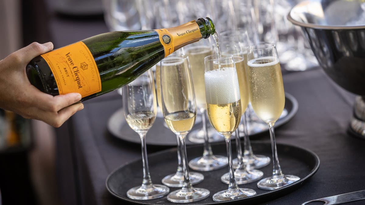 Champagne being poured into champagne flutes