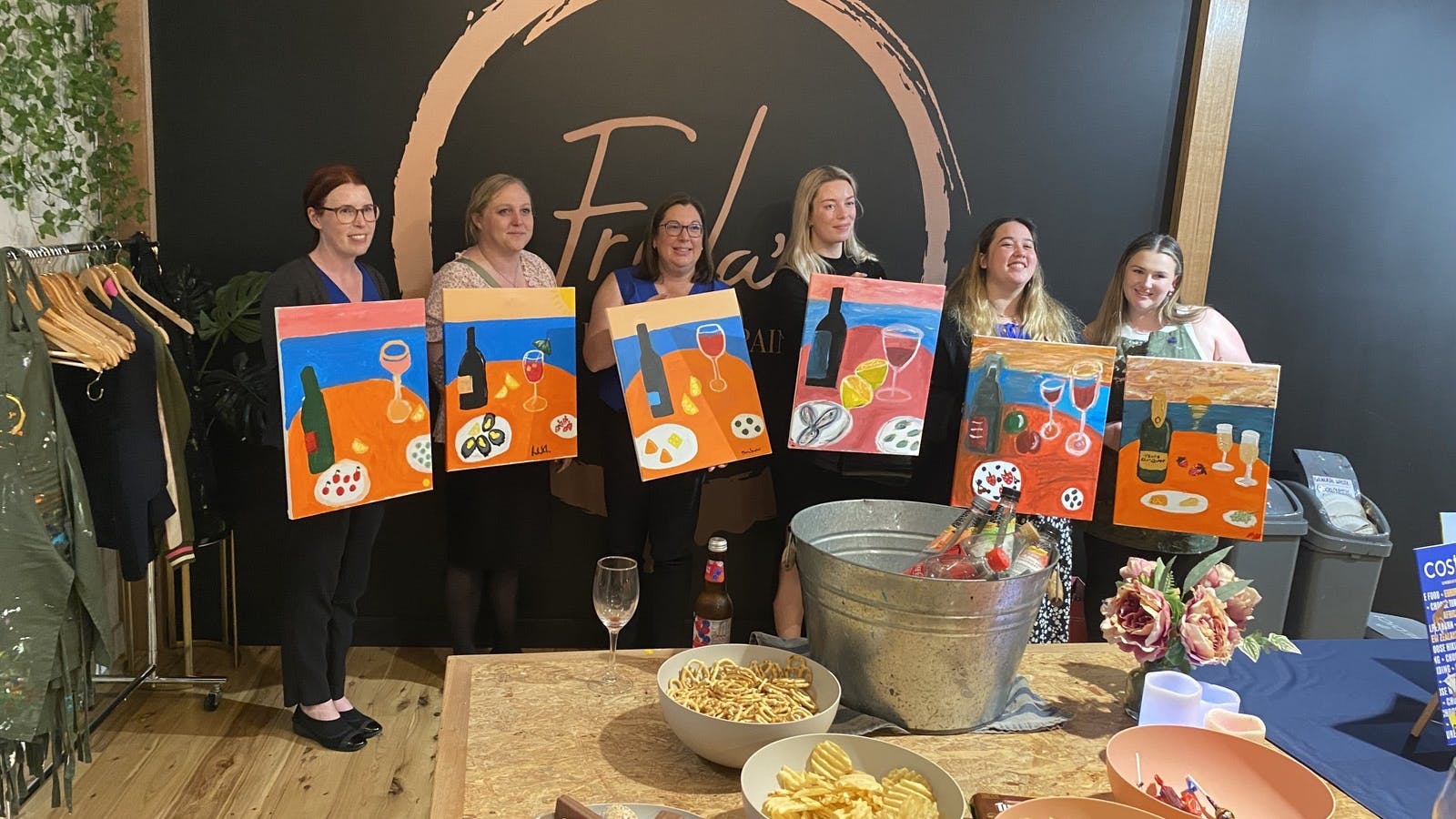 Happy customers, showing off their artwork .