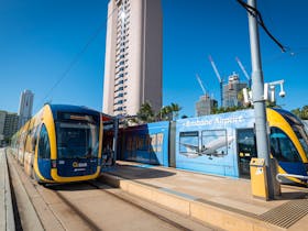 G:link north and southbound trams travelling through the Gold Coast