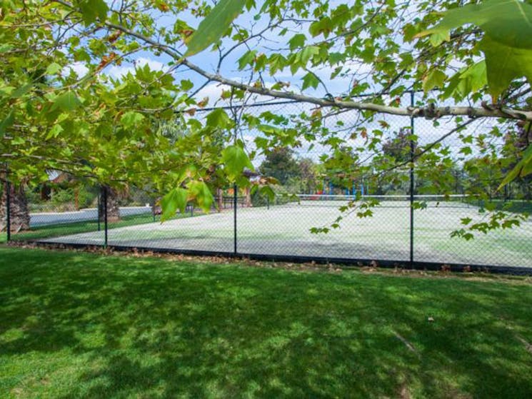 Tennis Court amongst landscape gardens