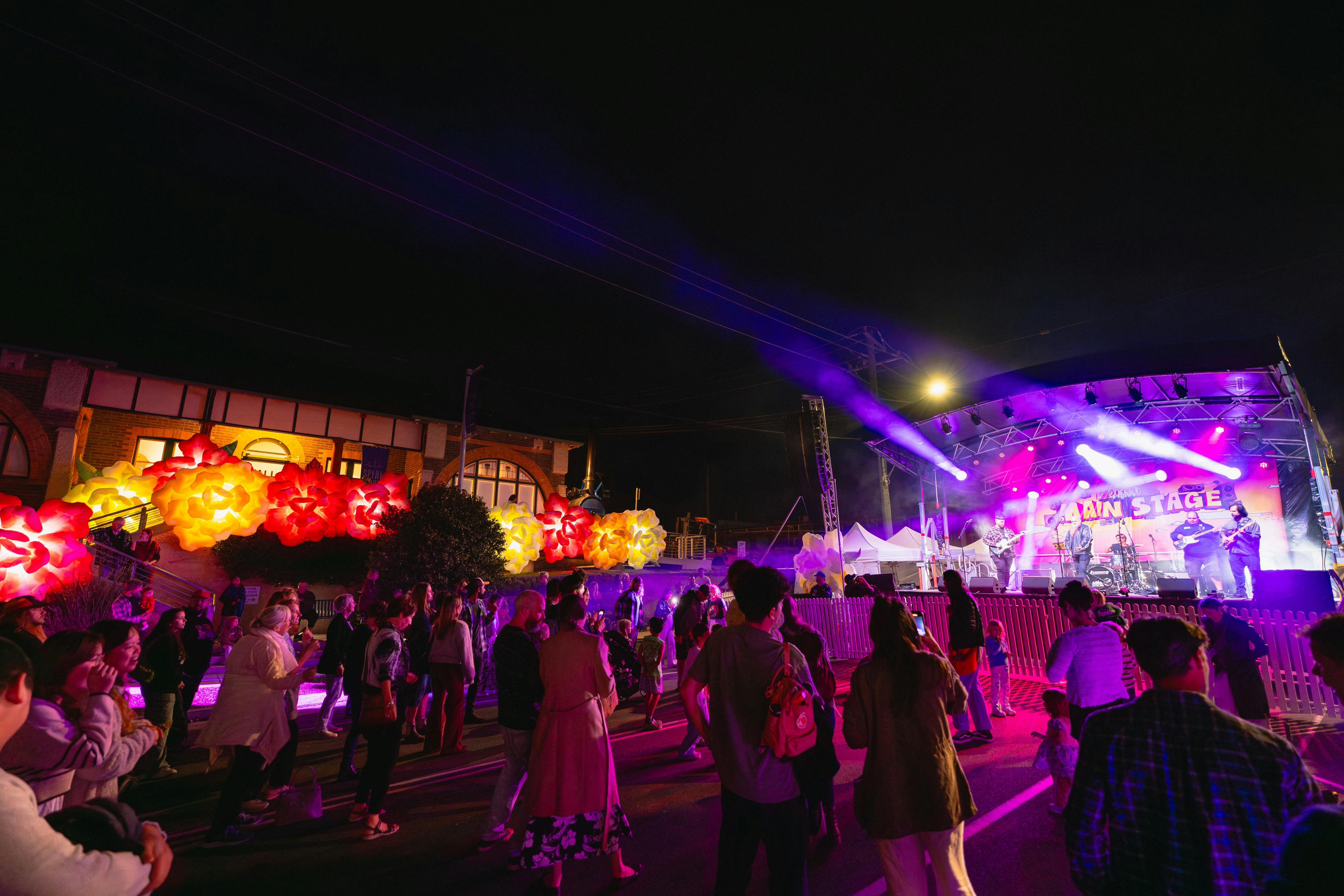 A crowd of people enjoy the mainstage at the Street Party.