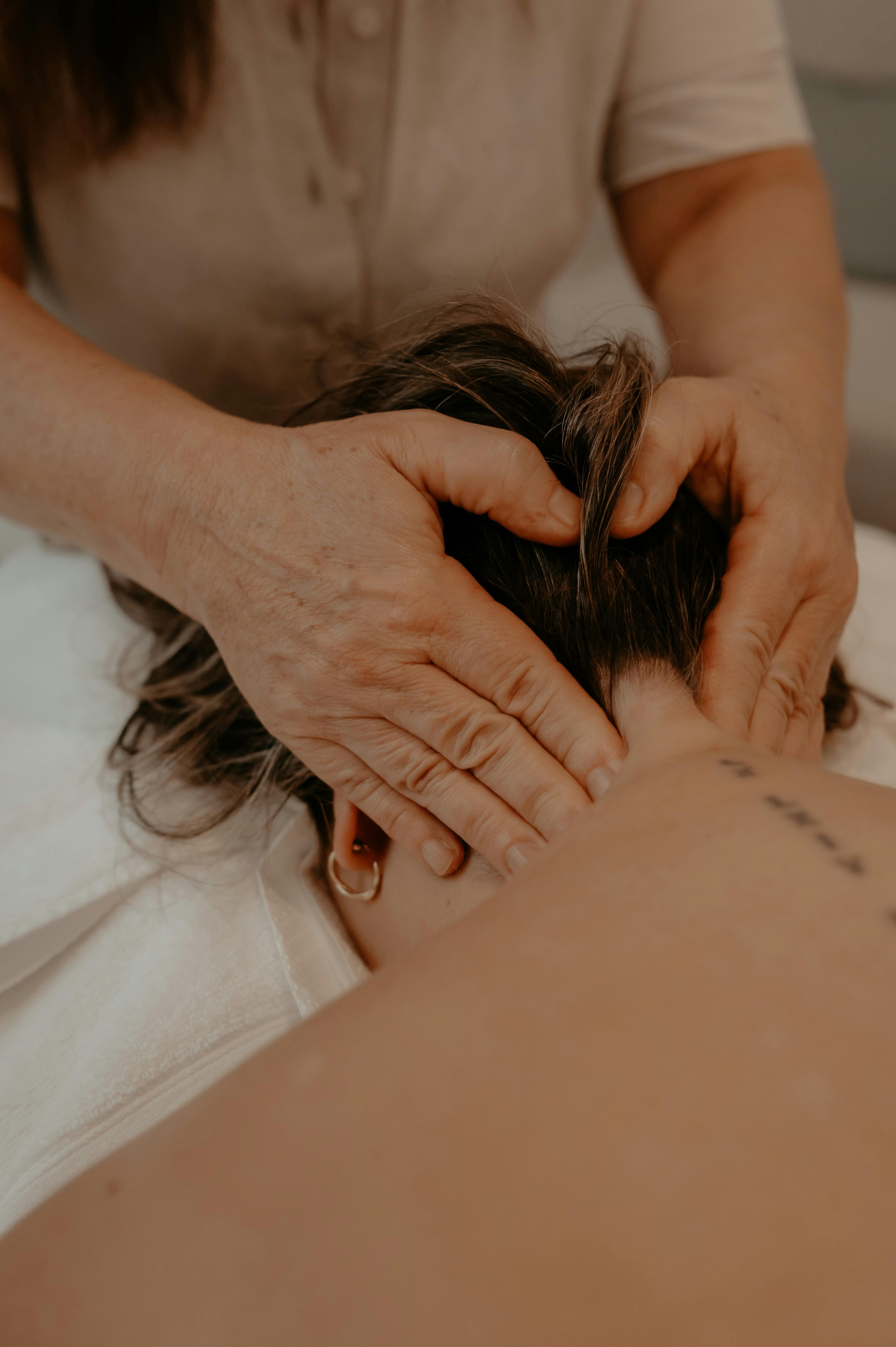 Massage therapist massaing the neck