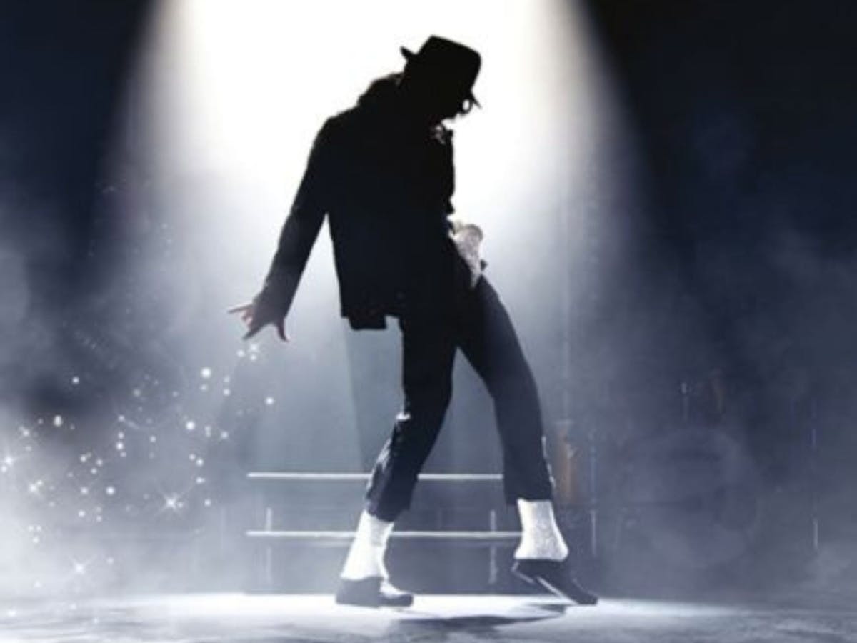 Spotlight on a silhouette of Michael Jackson with hat and white socks Spotlight on a silhouette of Michael Jackson with hat and white socks