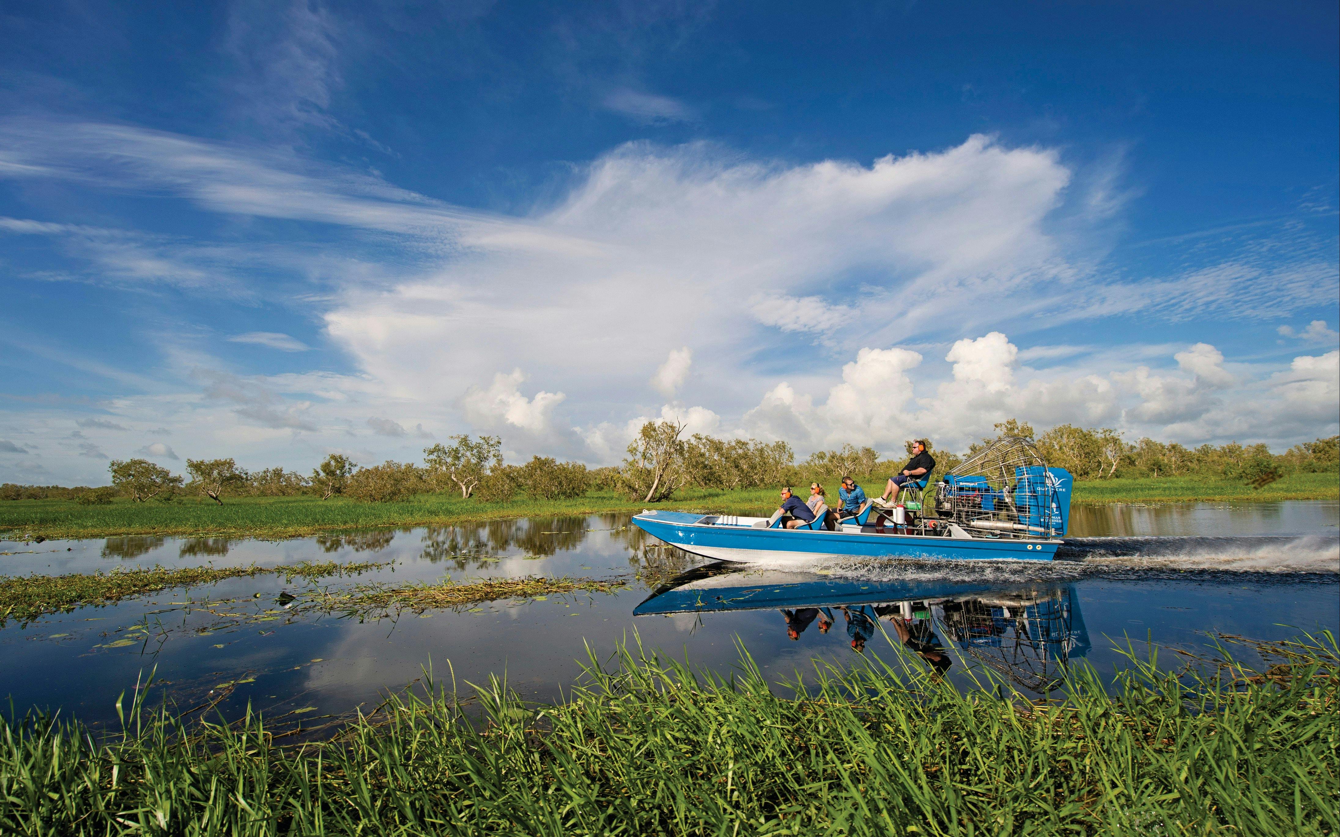 People air boating down Corroboree Billabong
