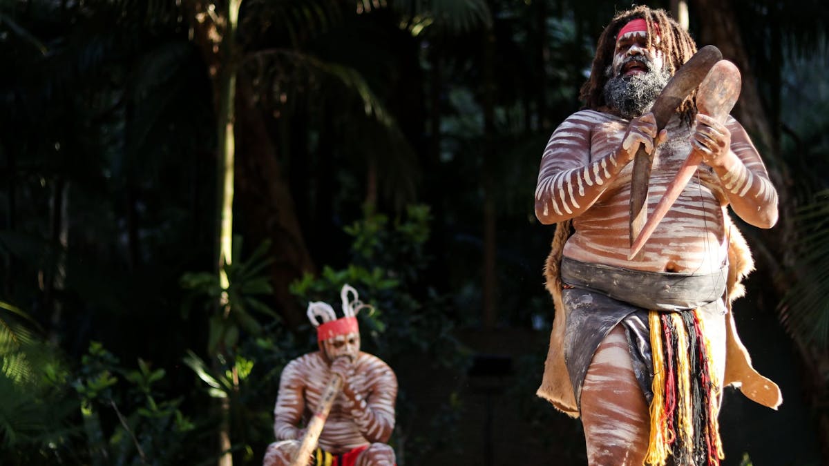 Two, male, First Nations Australians presenting cultural show at Currumbin Wildliufe Sanctuary