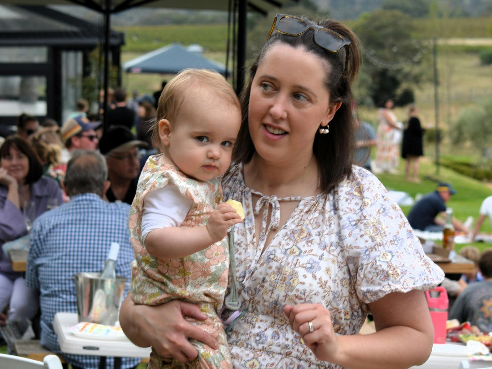 A mum and her baby at stockmans ridge wines