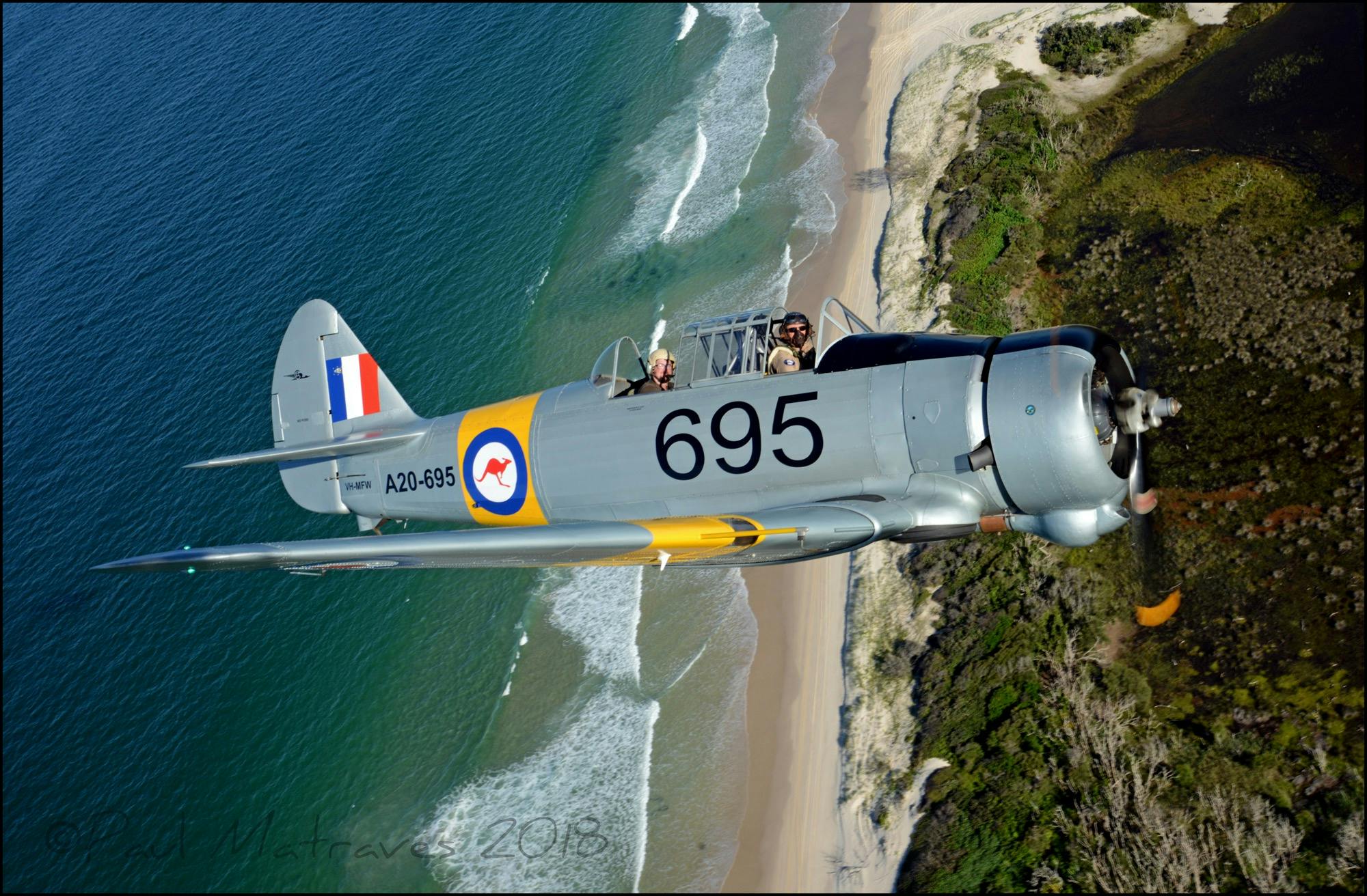 The Wirraway, flying over some of south east Queensland’s stunning coastal scenery.