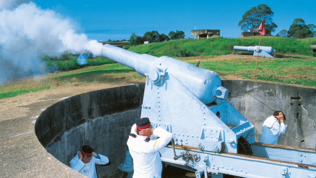 Actors inperiod costume firing the cannon, Fort Lytton.
