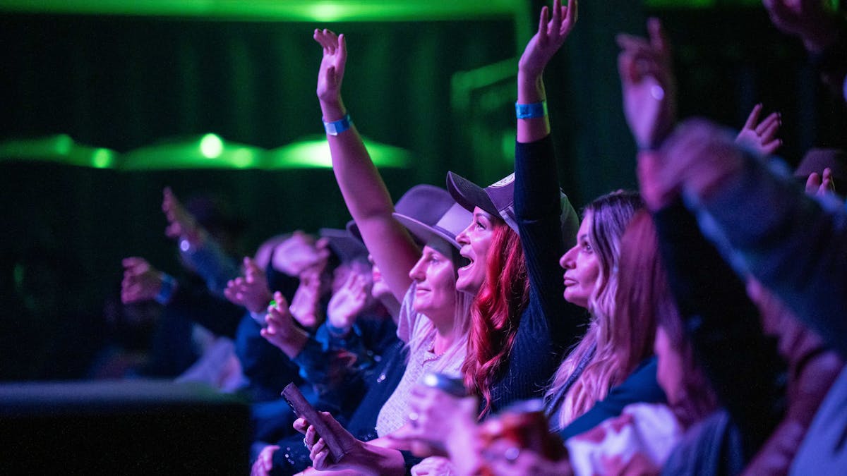 Young girls cheering watching an act at Lasso CMF 2025