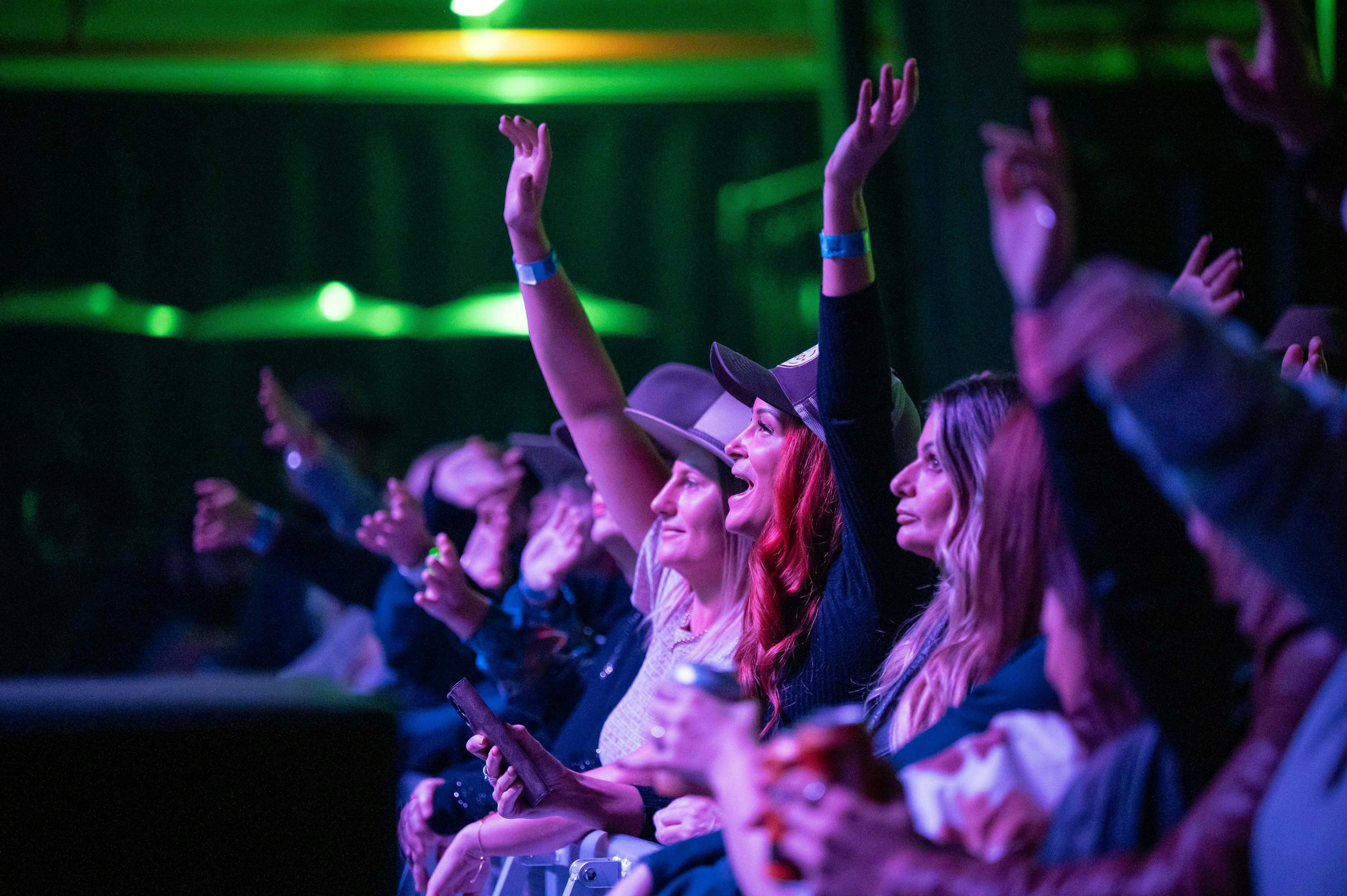 Young girls cheering watching an act at Lasso CMF 2025