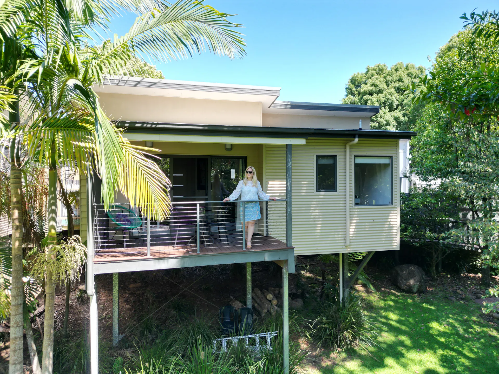 Guest enjoying the view from the balcony overlooking the Obi Obi Creek