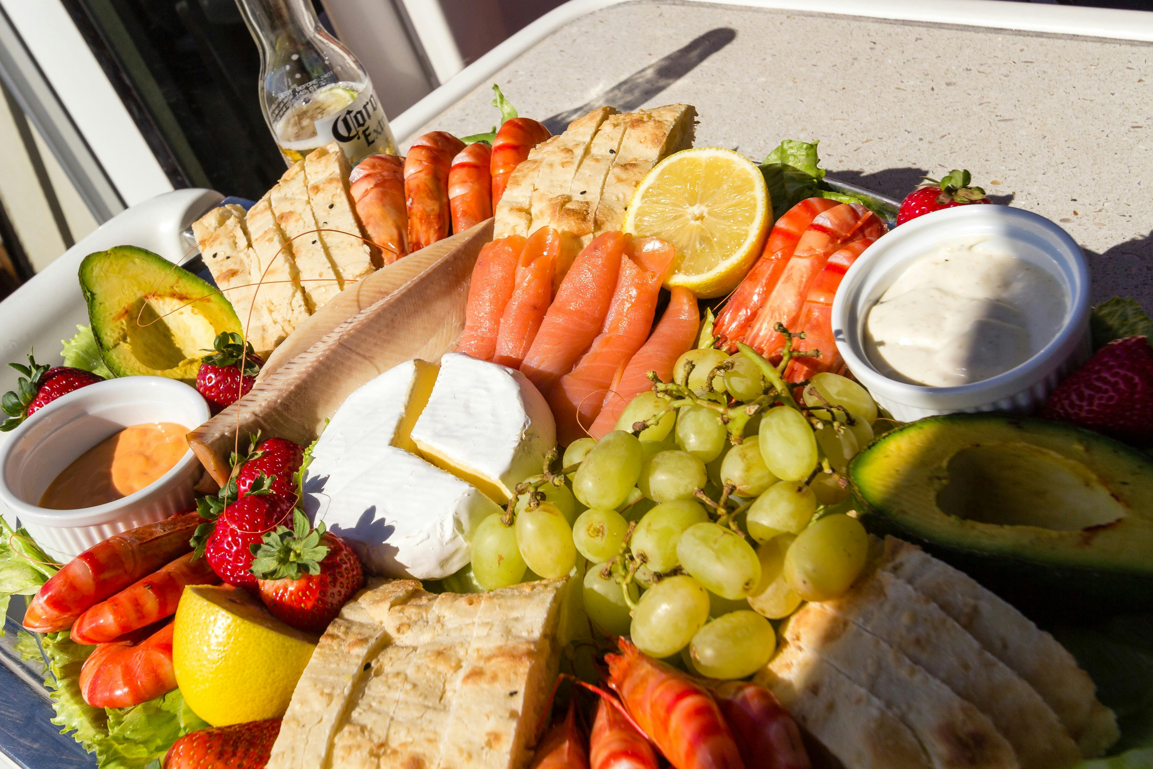 Seafood platter inluding prawns, fresh fruit, cheese and turkish bread