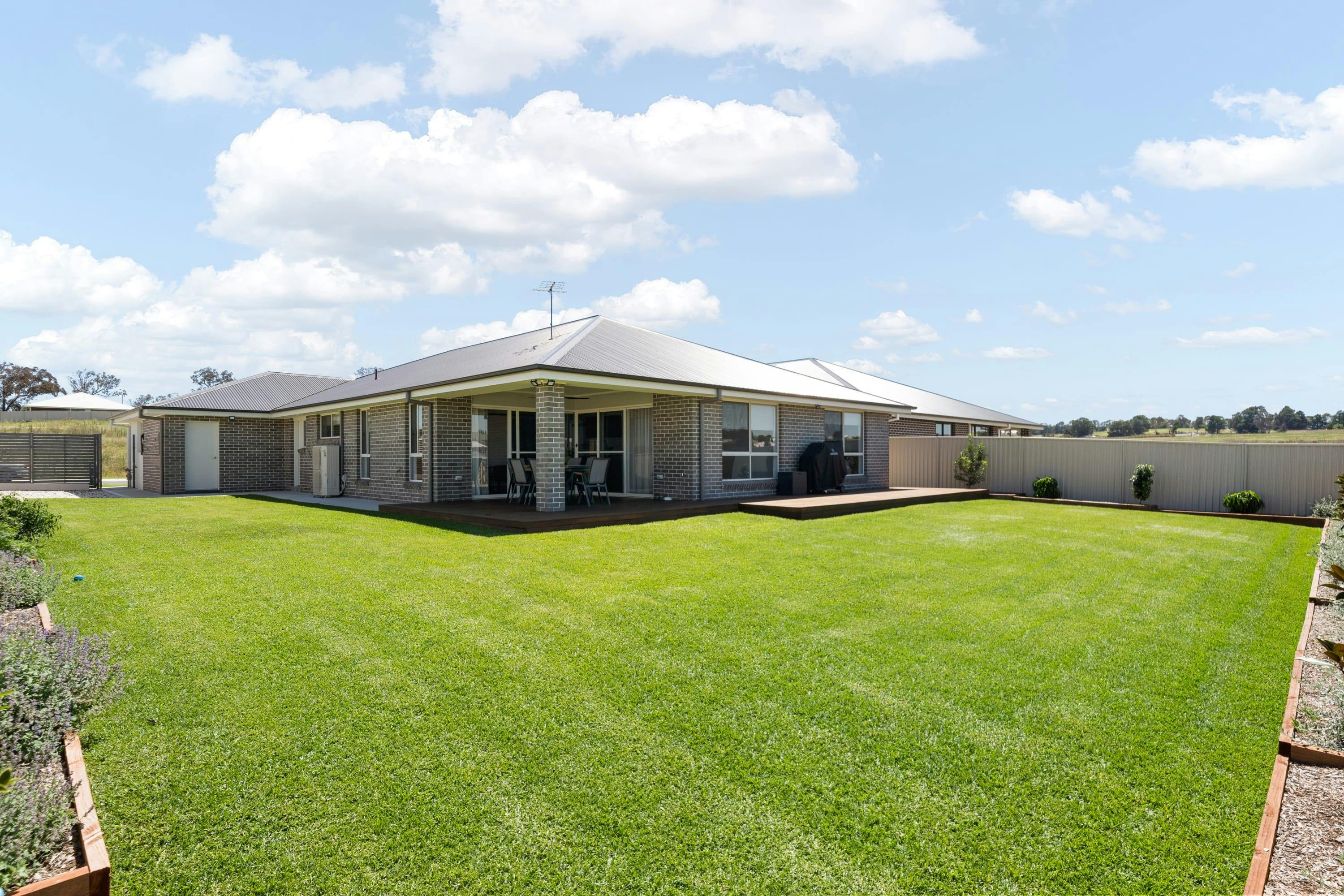 Large grass area with undercover dining area