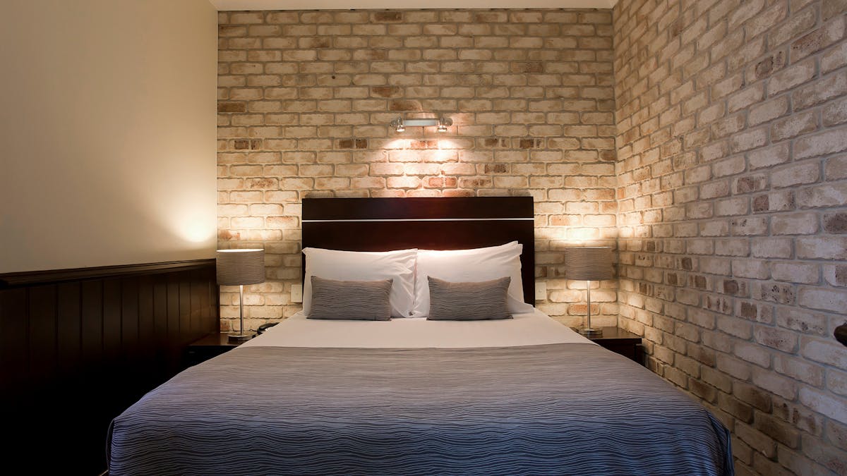 Queen bed in an Executive Spa Room